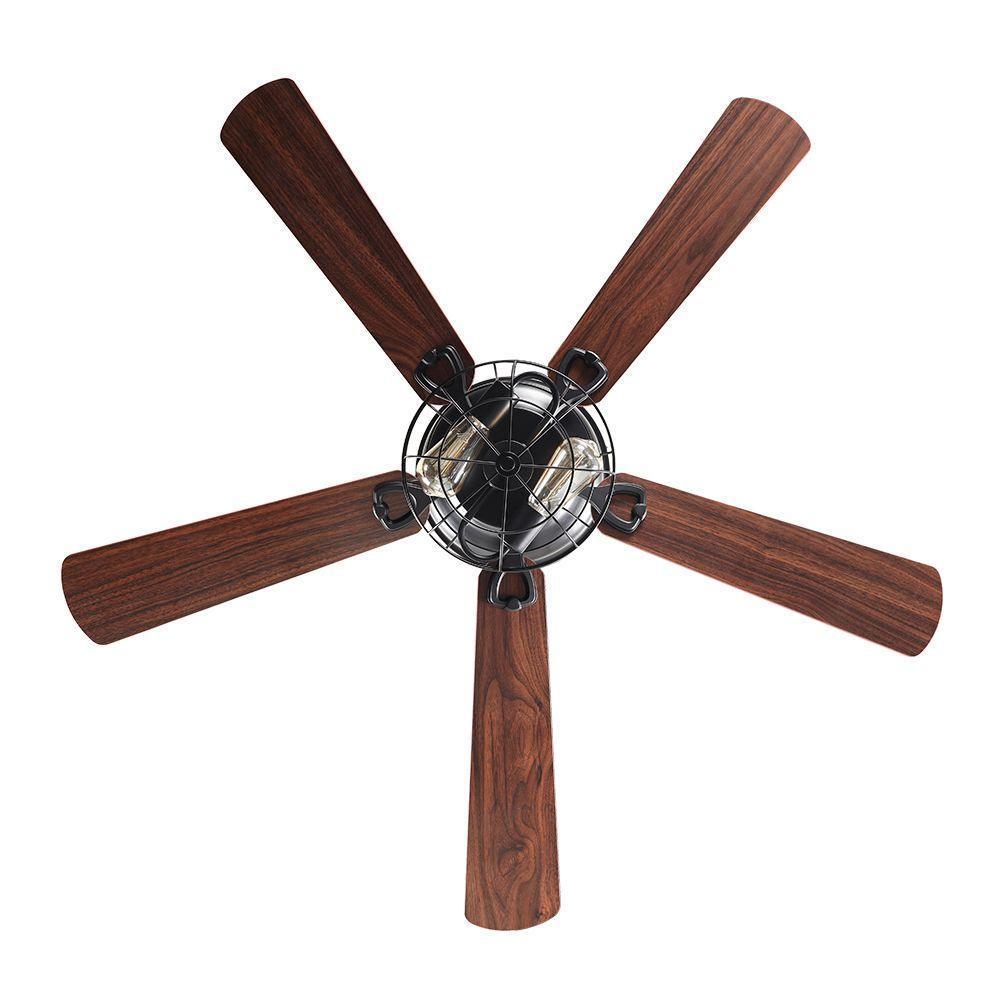 Flush-mount ceiling fan viewed from below with dark wood blades and black light