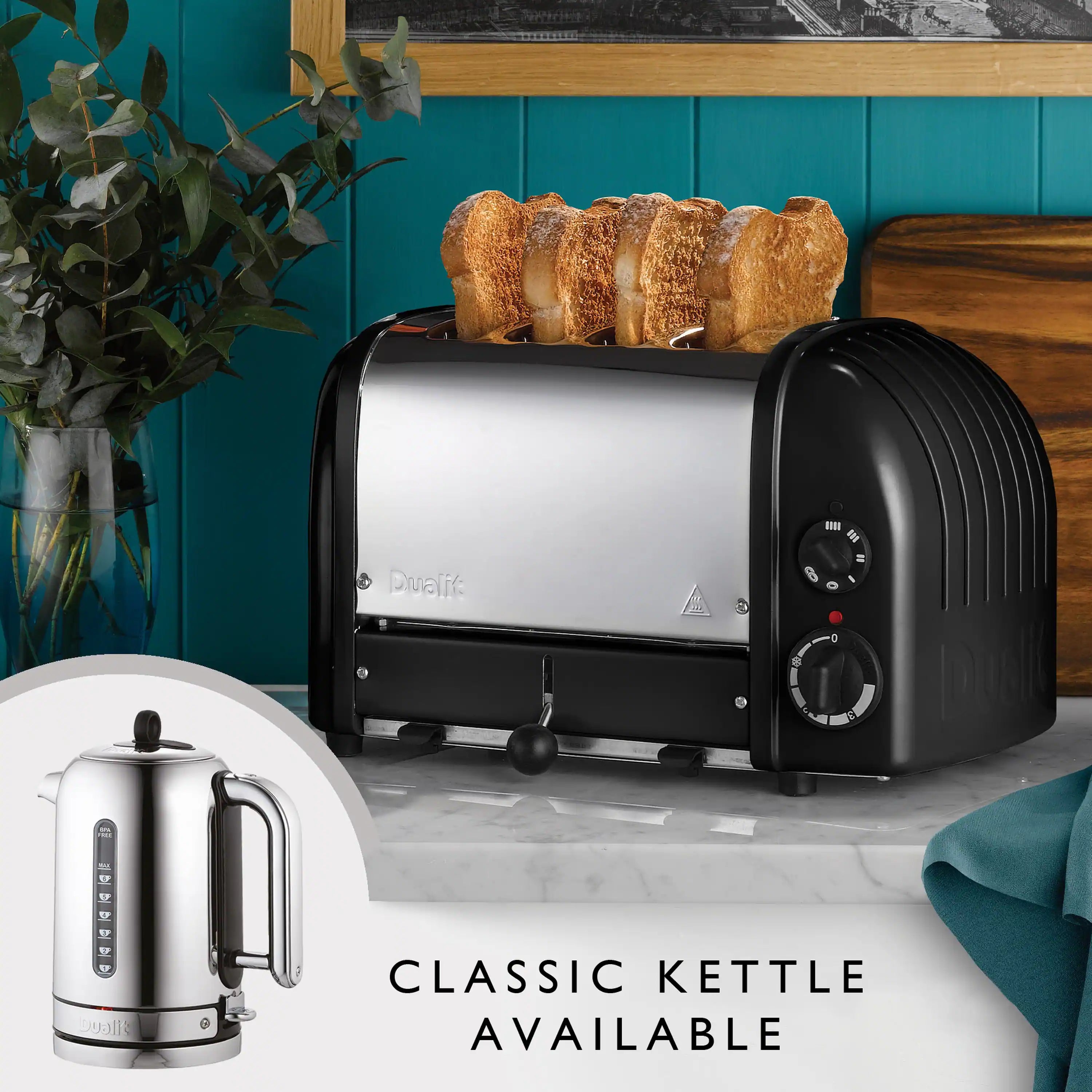 Dualit 4-slice NewGen toaster with bread slices on top and side-mounted control dials