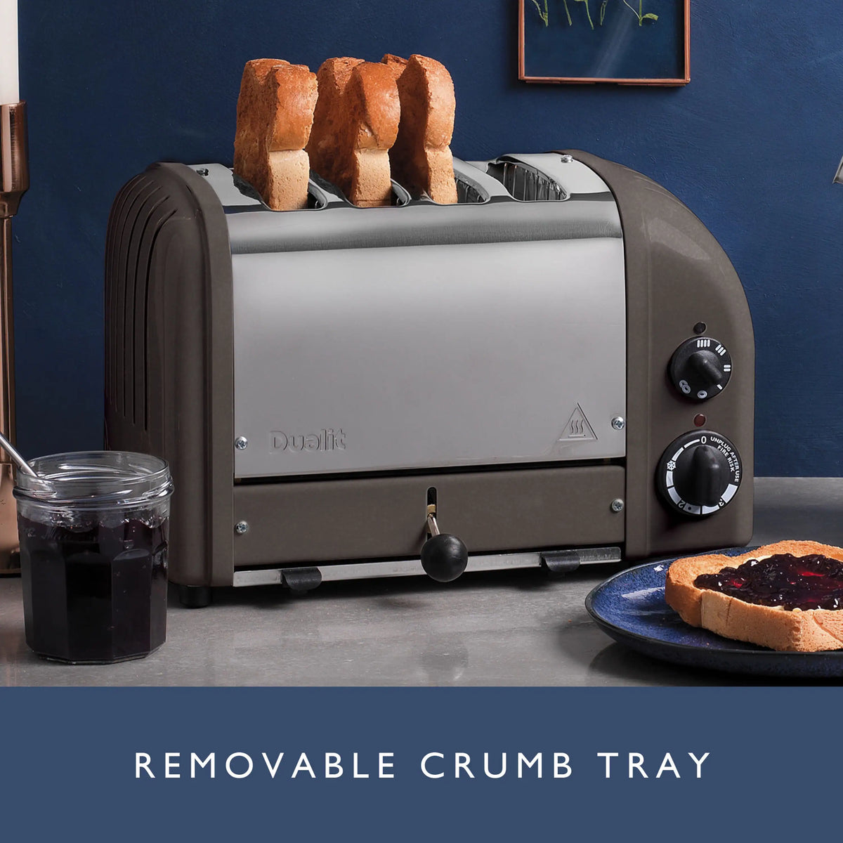 Dualit 4-slice toaster in metallic charcoal with removable crumb tray visible