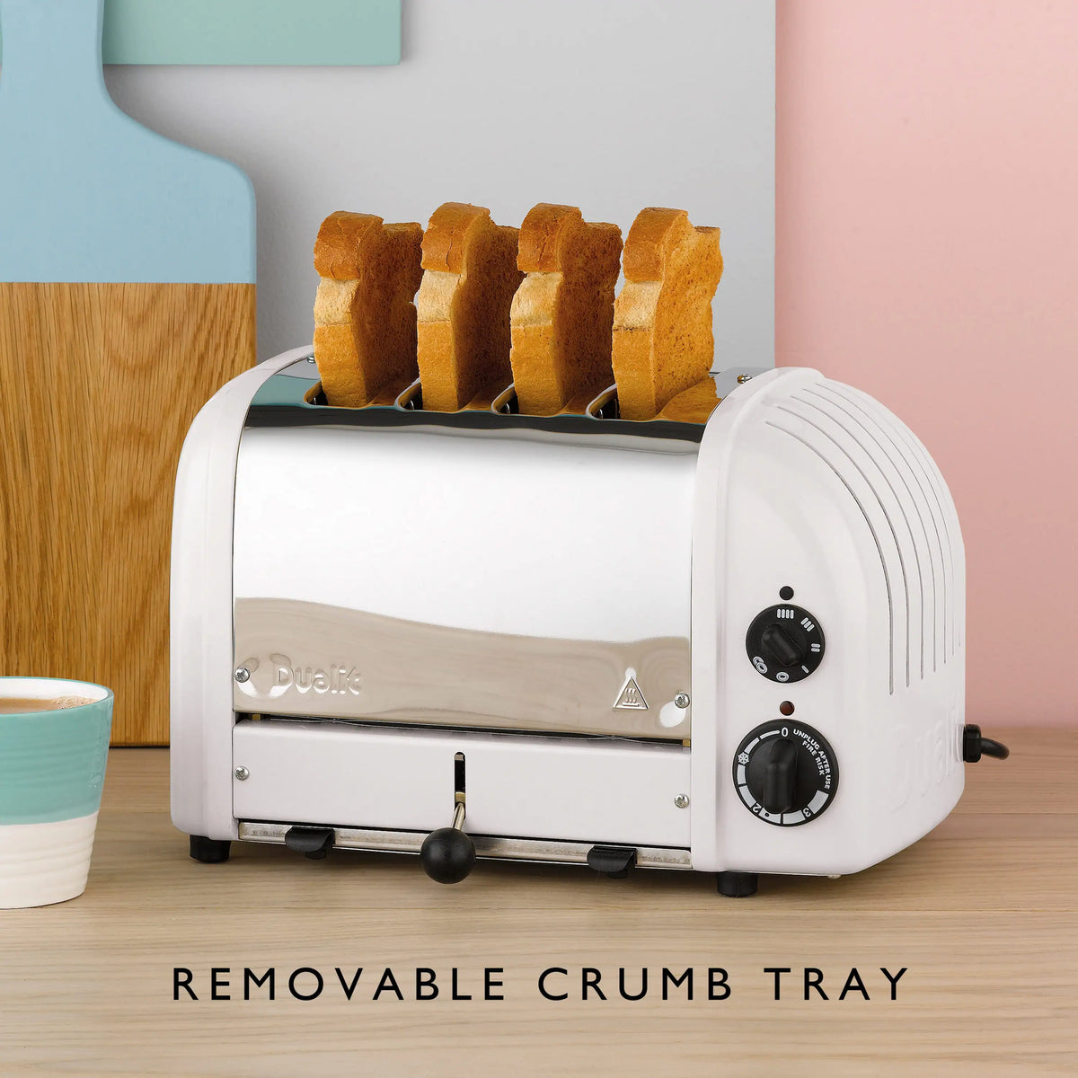 White 4-slice toaster with toast in the slots on a countertop