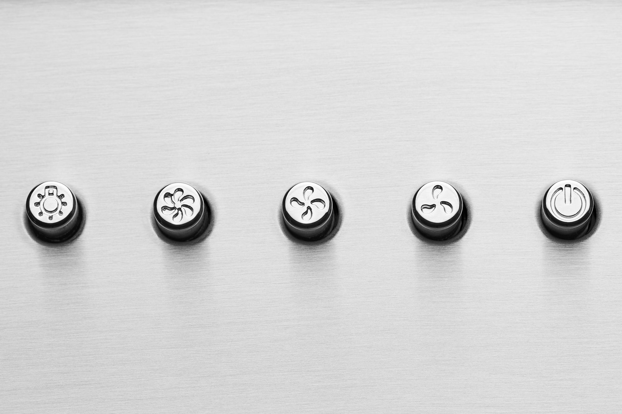 Range hood control panel with five round buttons on stainless steel