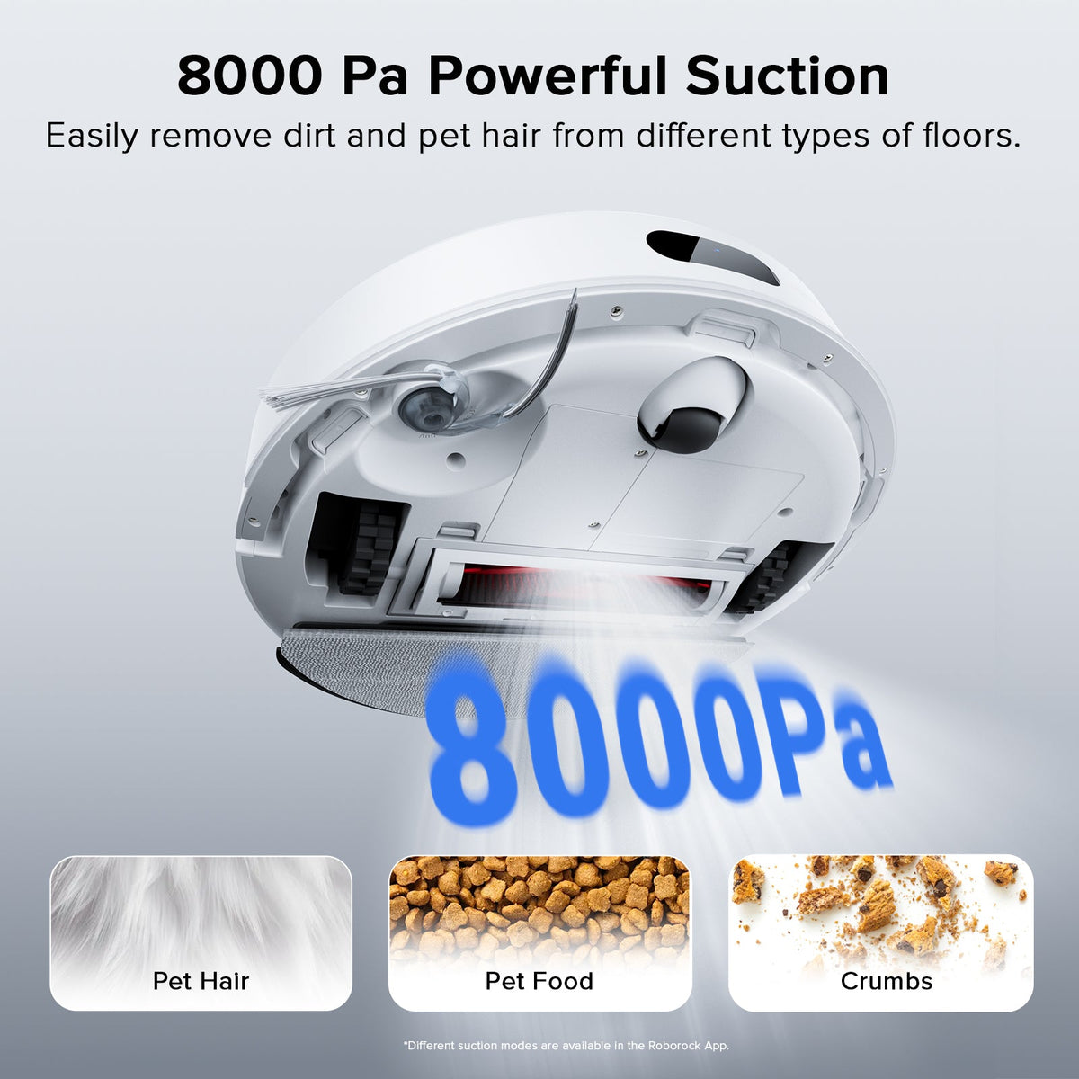 White robot vacuum underside with spinning brush rollers and suction ports
