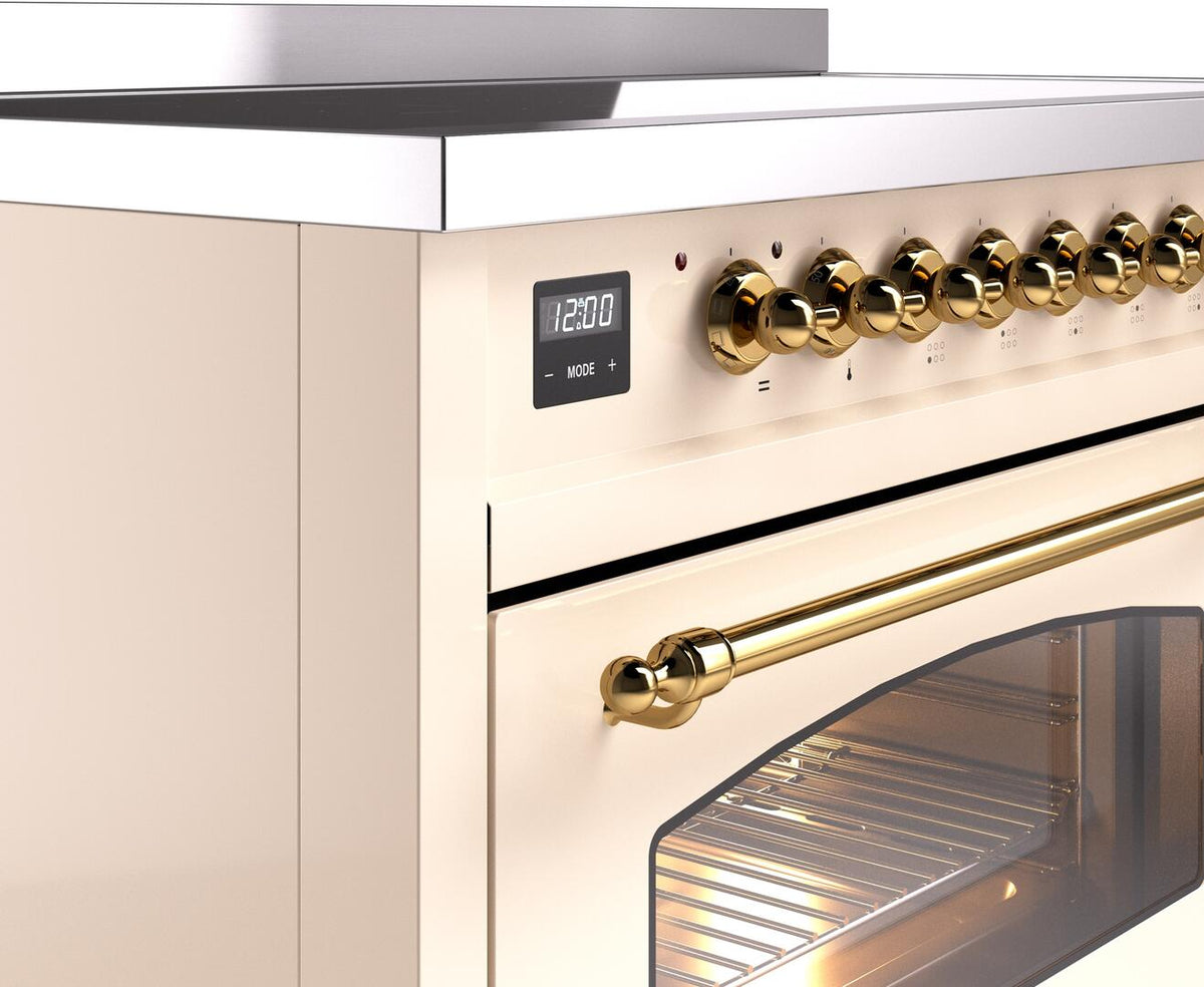 Control panel of electric induction range with brass knobs and digital display
