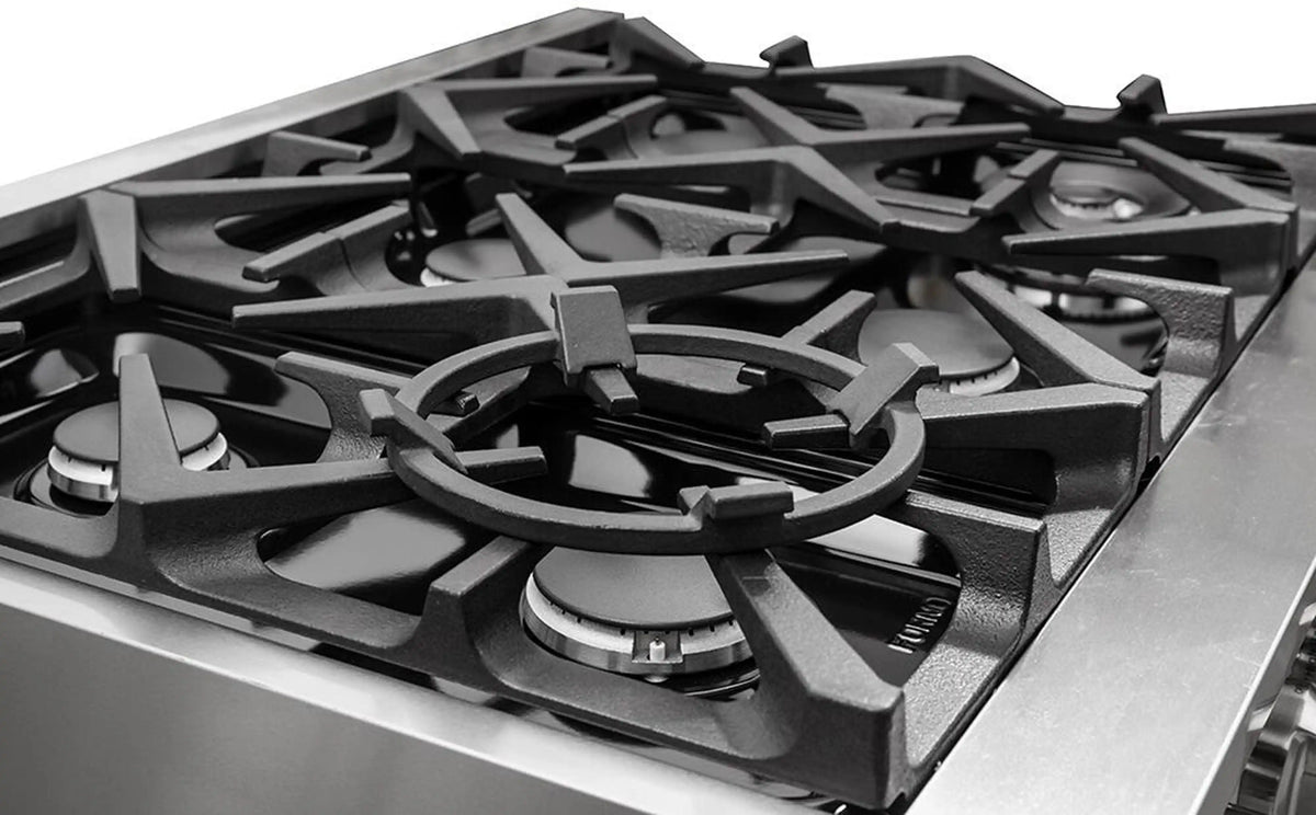 Stainless steel dual fuel range cooktop with black grates and multiple burners