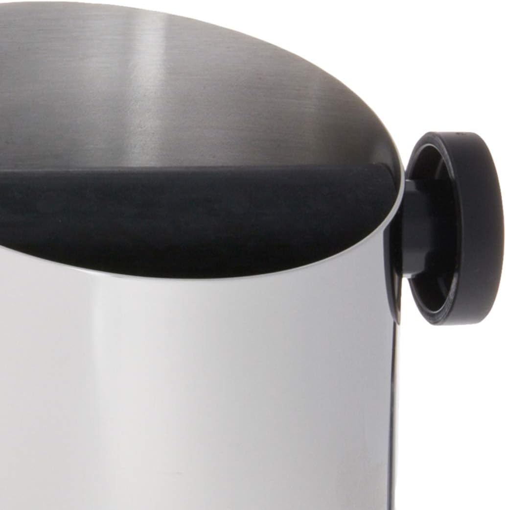 Close-up of domed lid and black side handle on stainless coffee knock-out box
