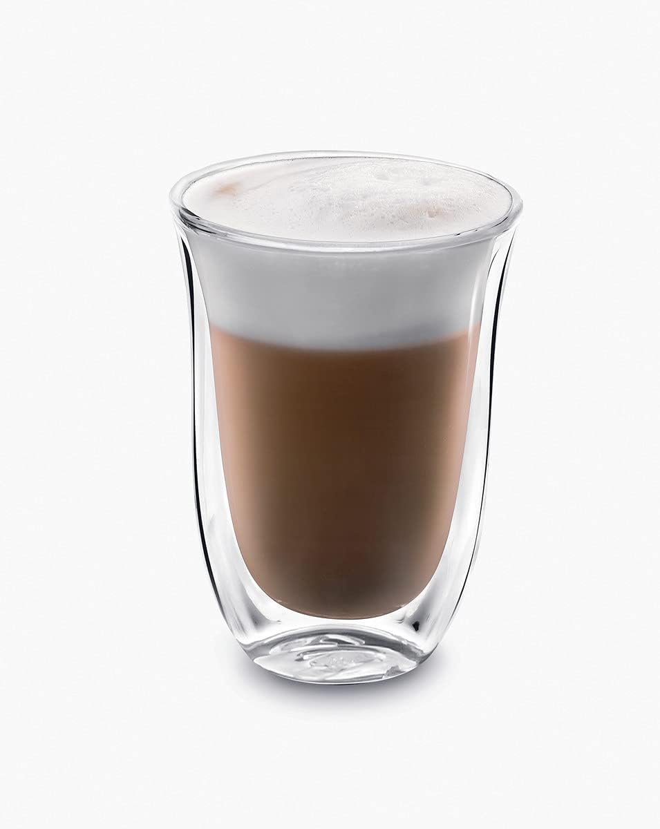 Double wall latte macchiato glass with dark coffee layer and creamy foam top, clear