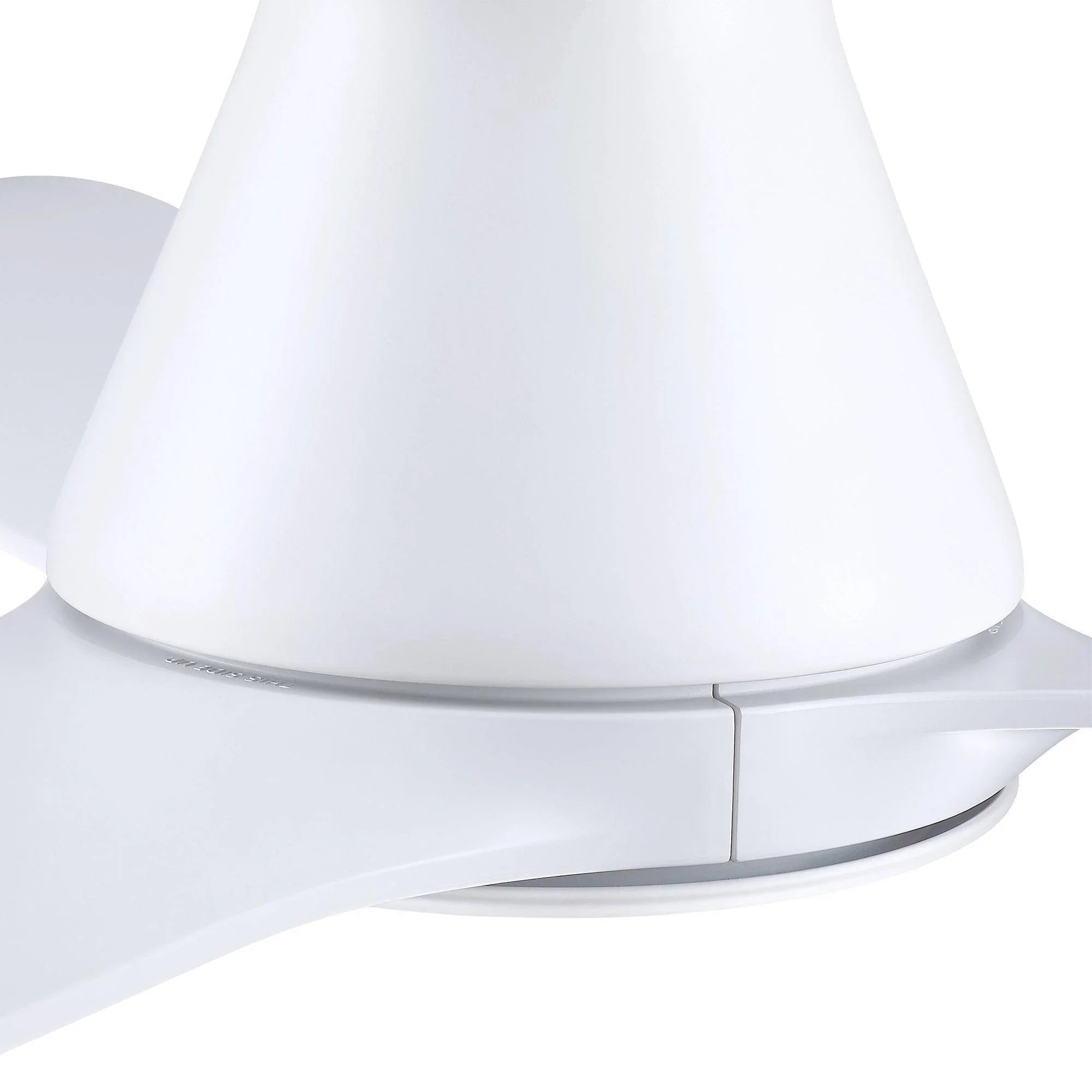 Close-up of white ceiling fan base and blade attachment near the light housing.