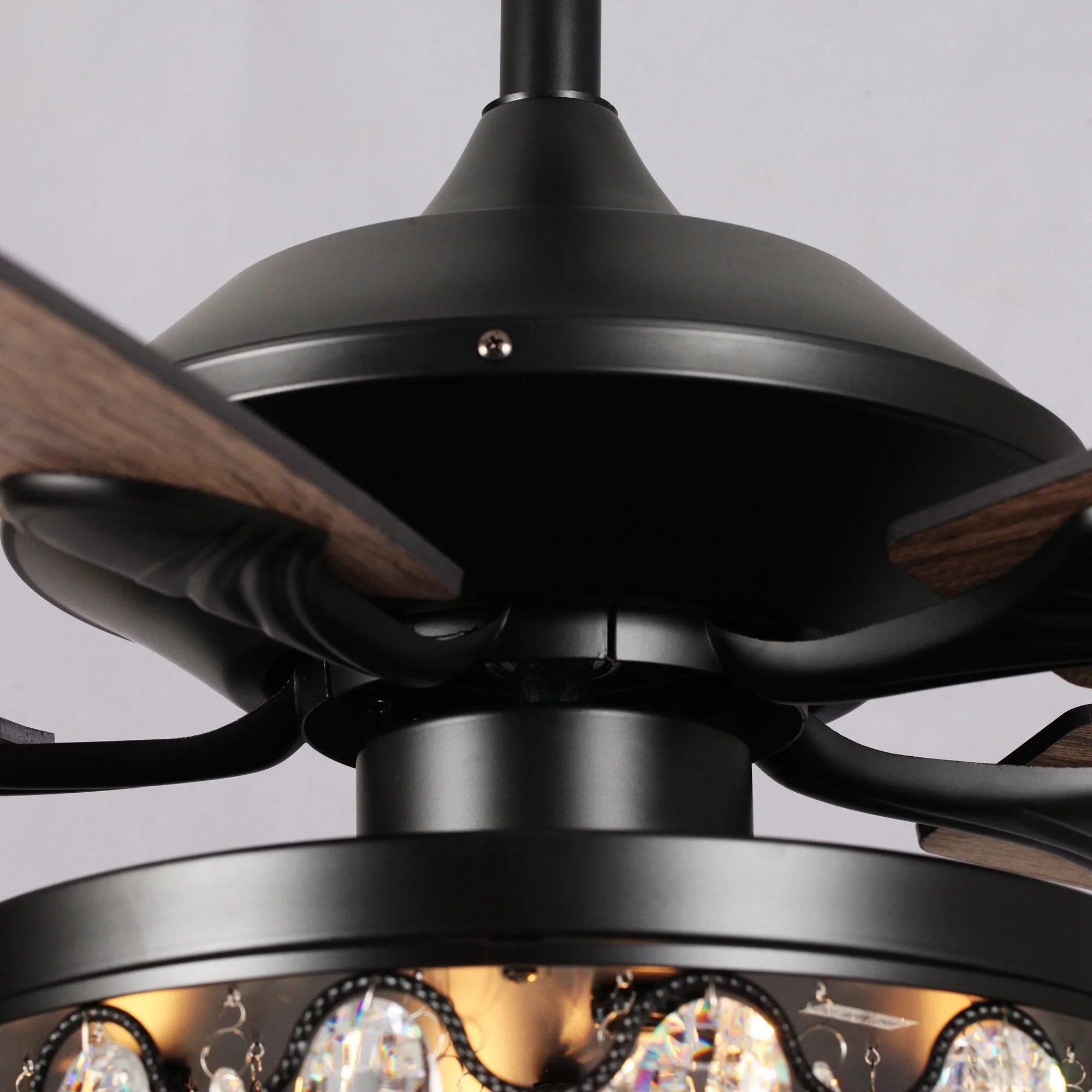 Black ceiling fan motor housing with dark wood reversible blades