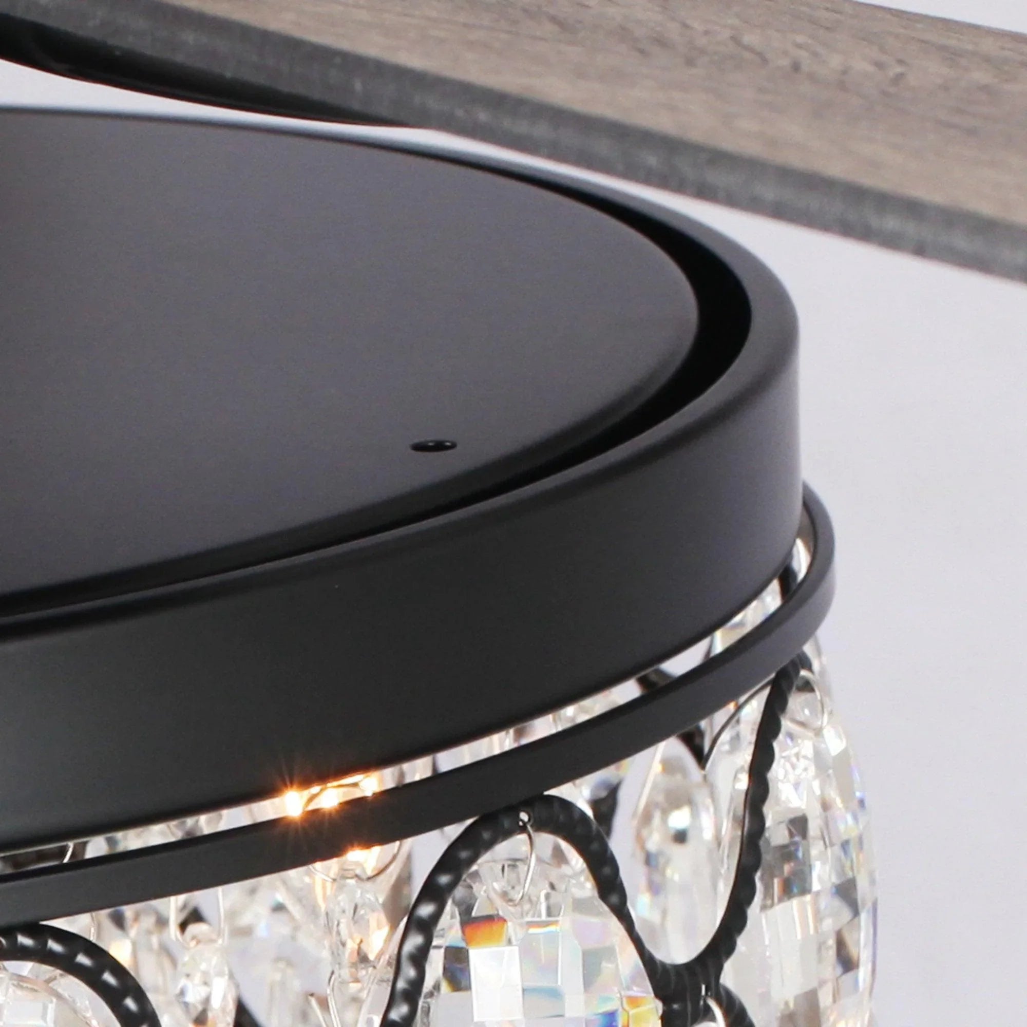 Ceiling fan blade and black light frame with lit crystal bulbs