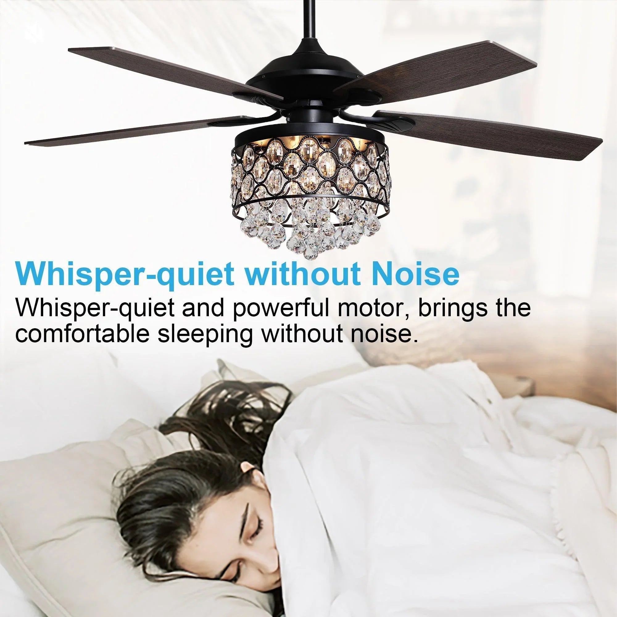 Black ceiling fan with crystal light above a bed for quiet airflow