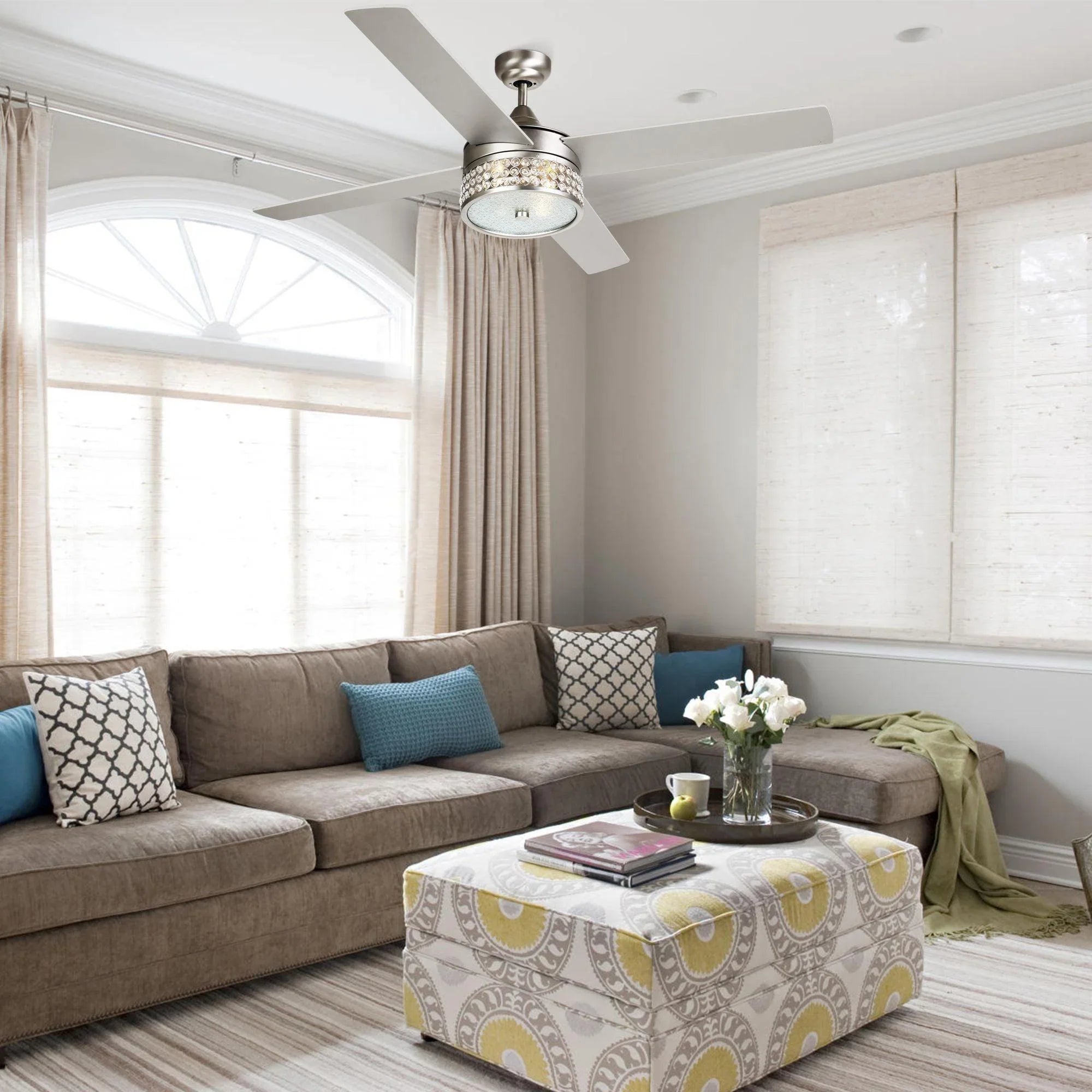 Satin nickel ceiling fan with integrated light and 5 reversible blades in living room