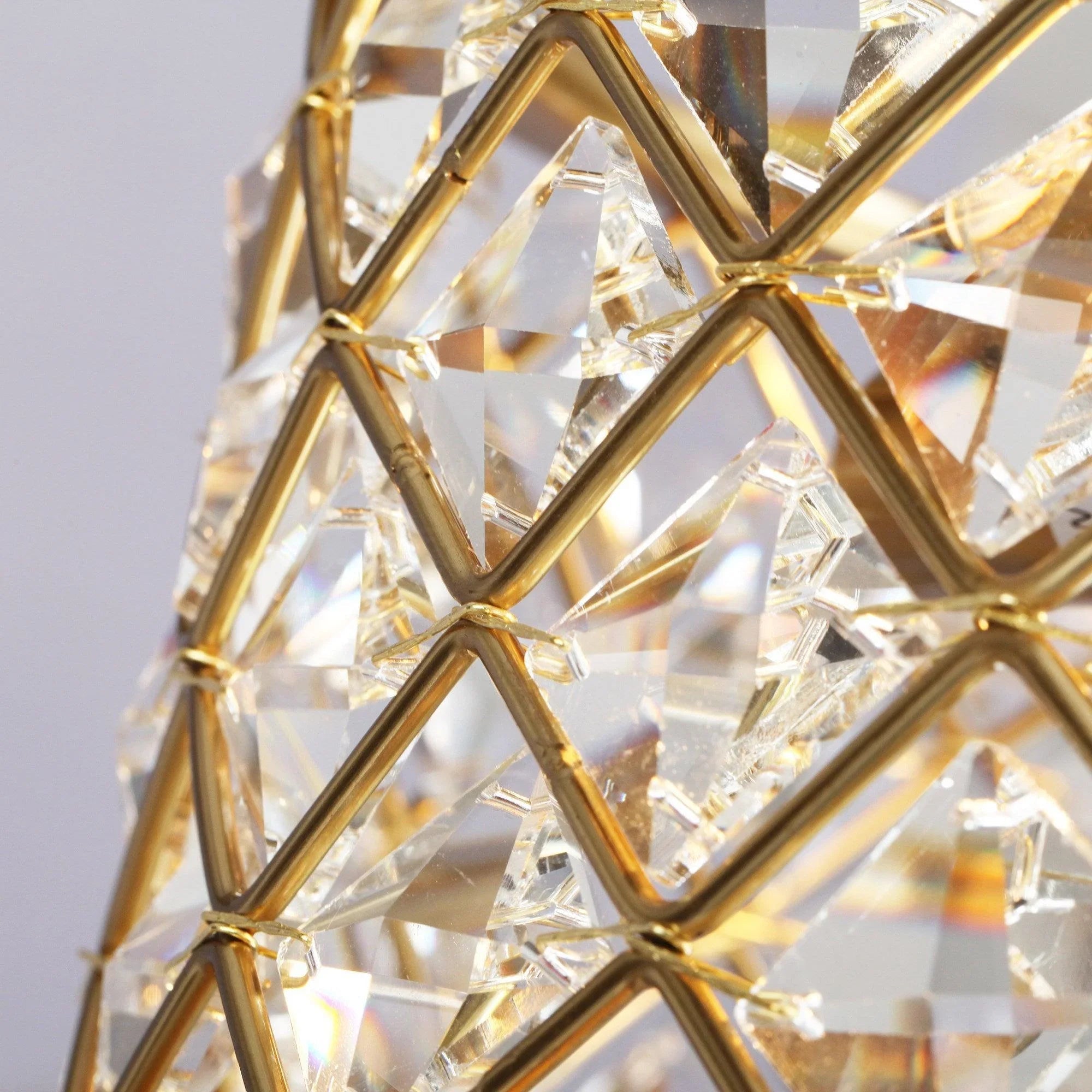 Close-up of crystal drum with gold diamond lattice frame