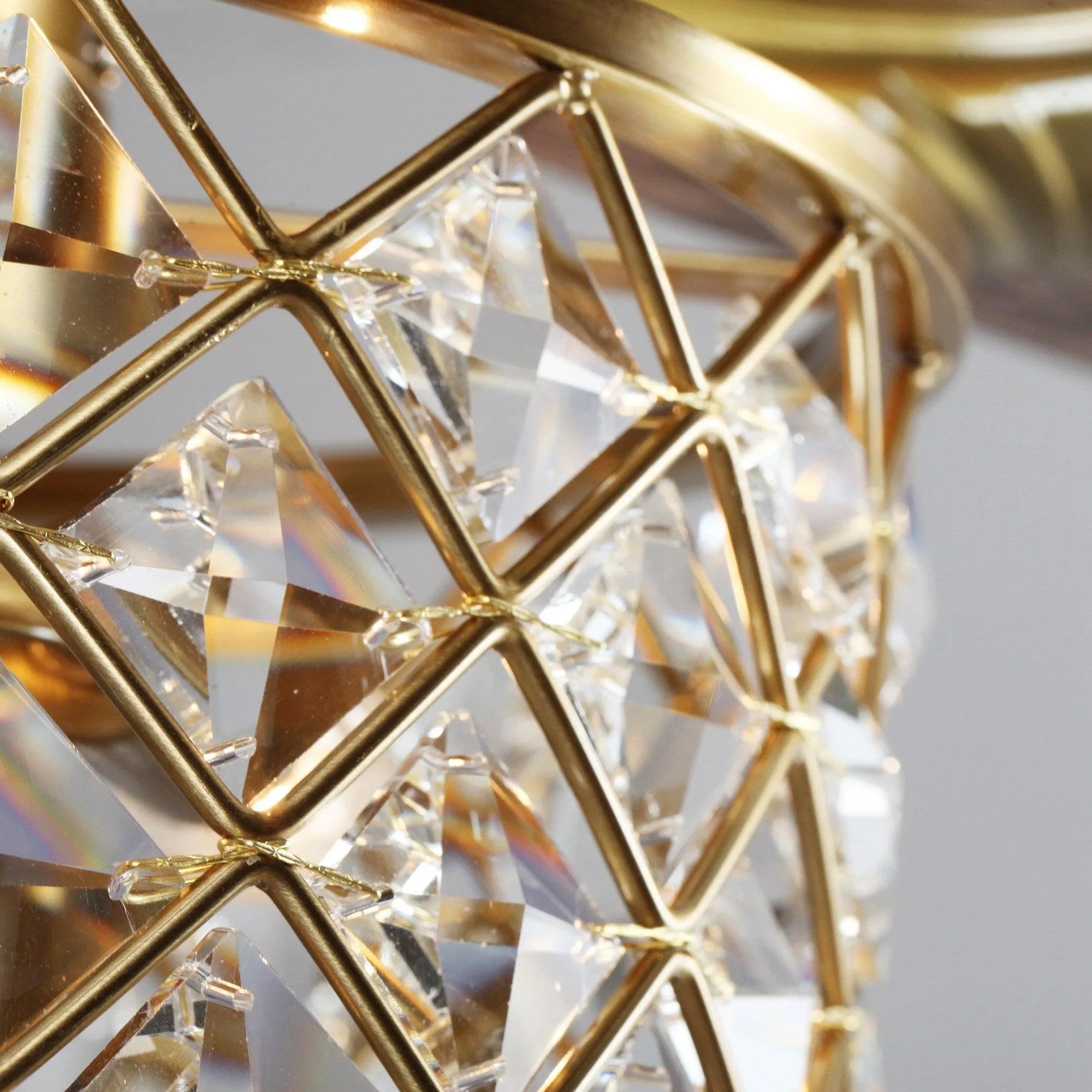 Close-up of gold crystal lattice light with prismatic panels