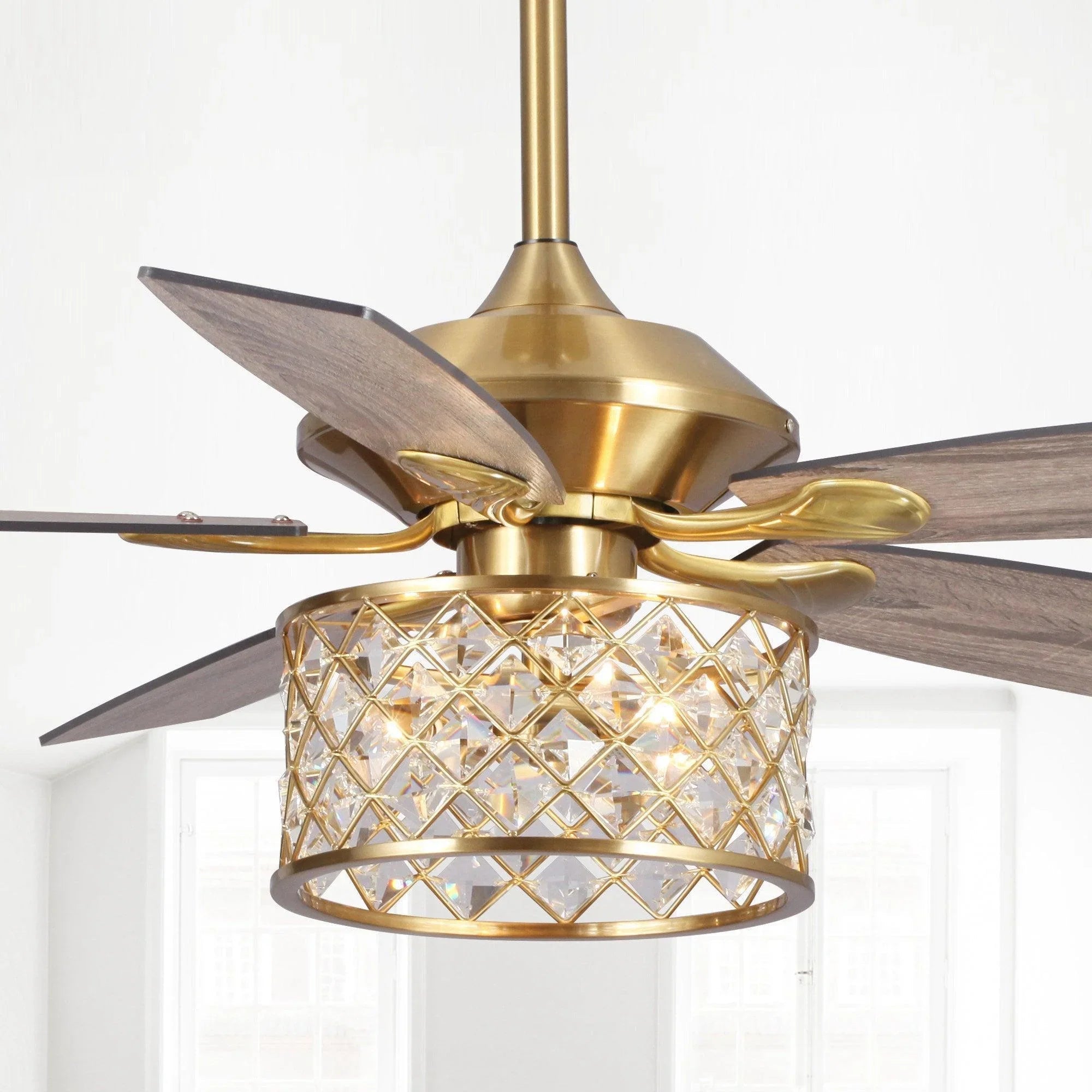 Golden ceiling fan with crystal light cage and five dark wood blades