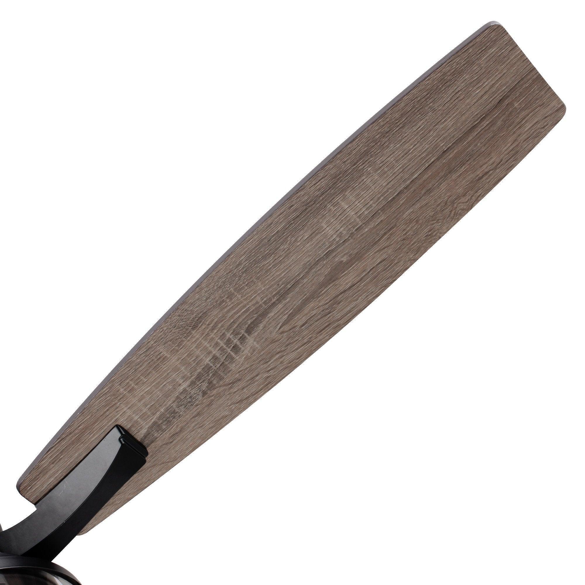 Close-up of a wood-look ceiling fan blade with visible grain finish
