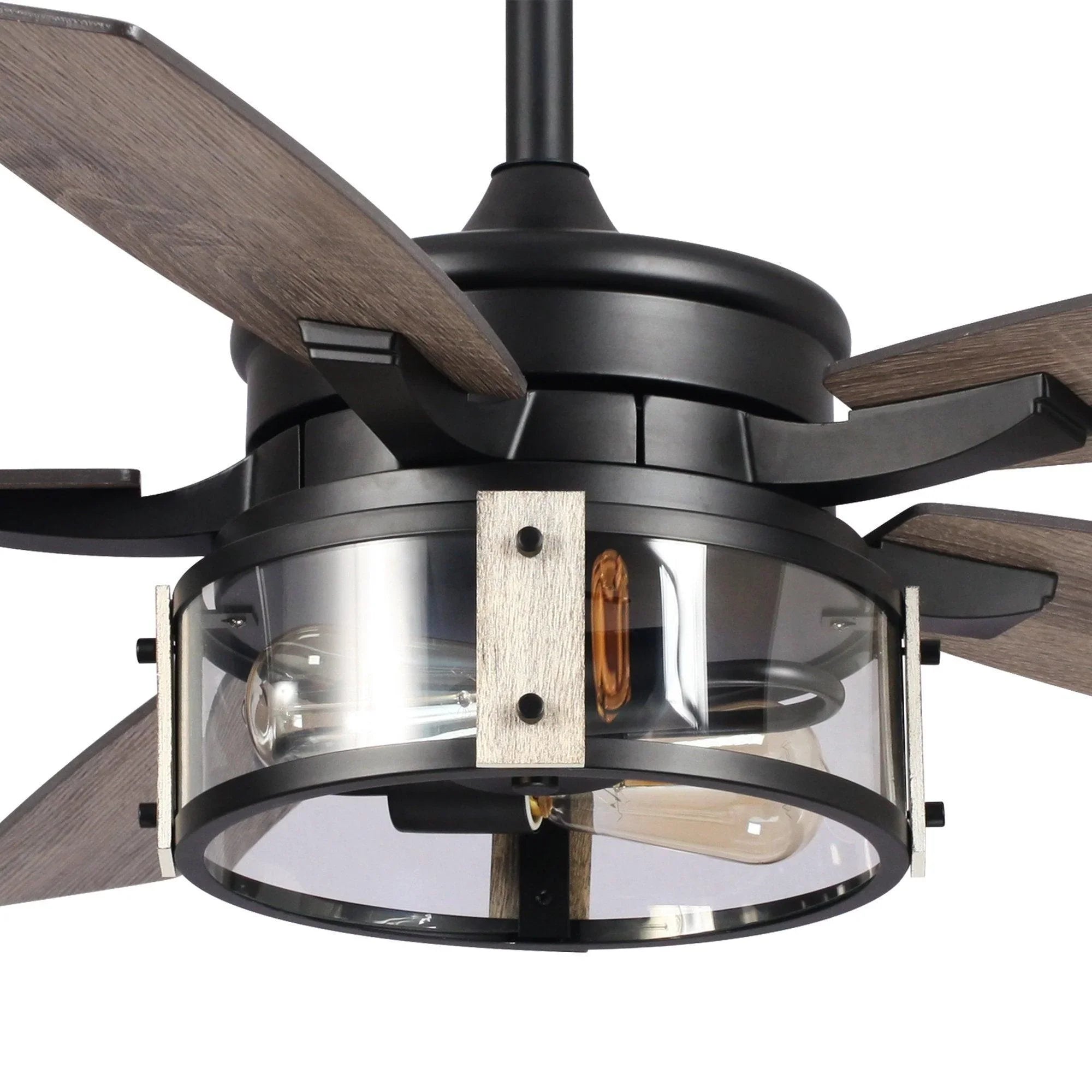 Close-up of black fan motor housing with light glass and wood-look blades