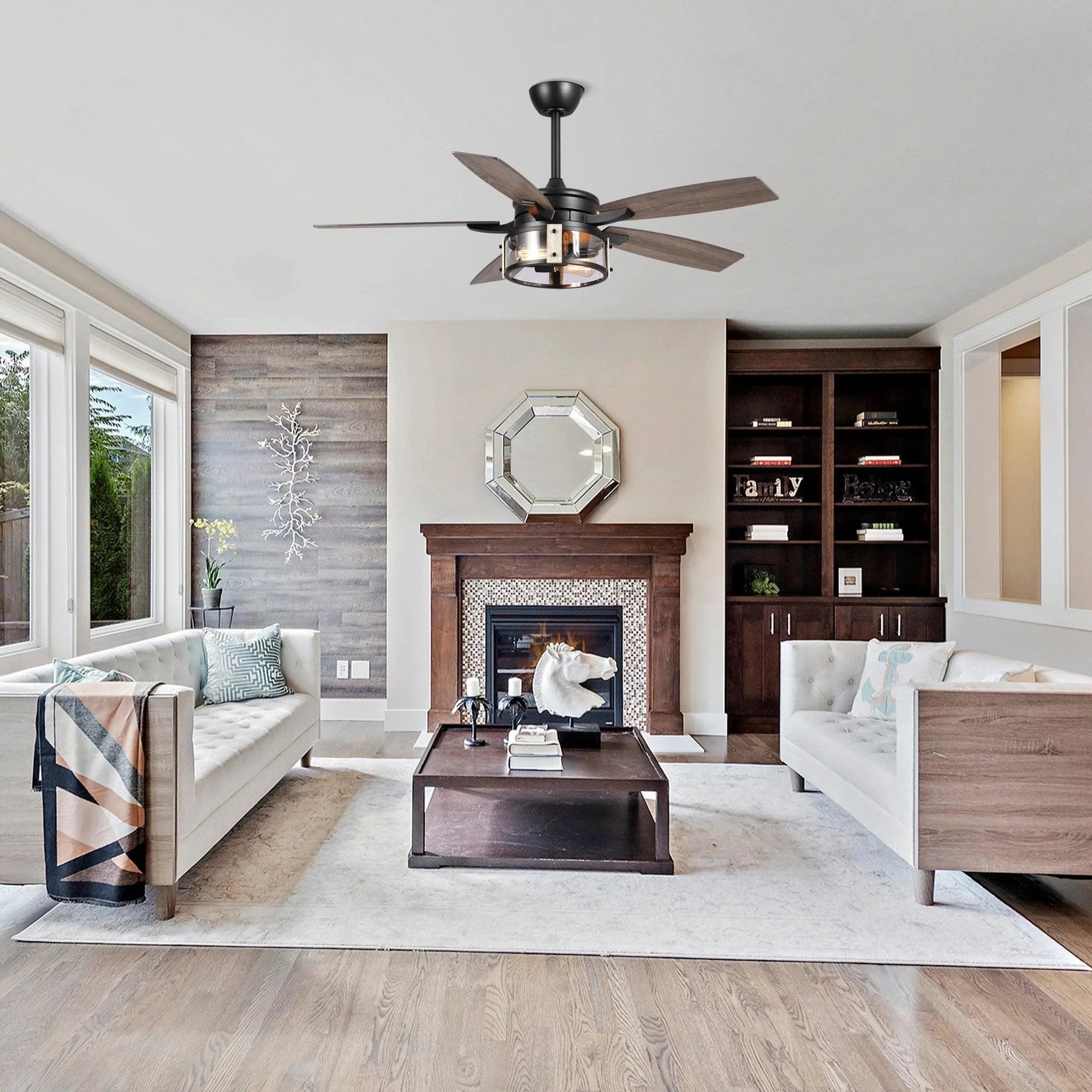 Black ceiling fan with wood-look blades and light fixture in modern living space
