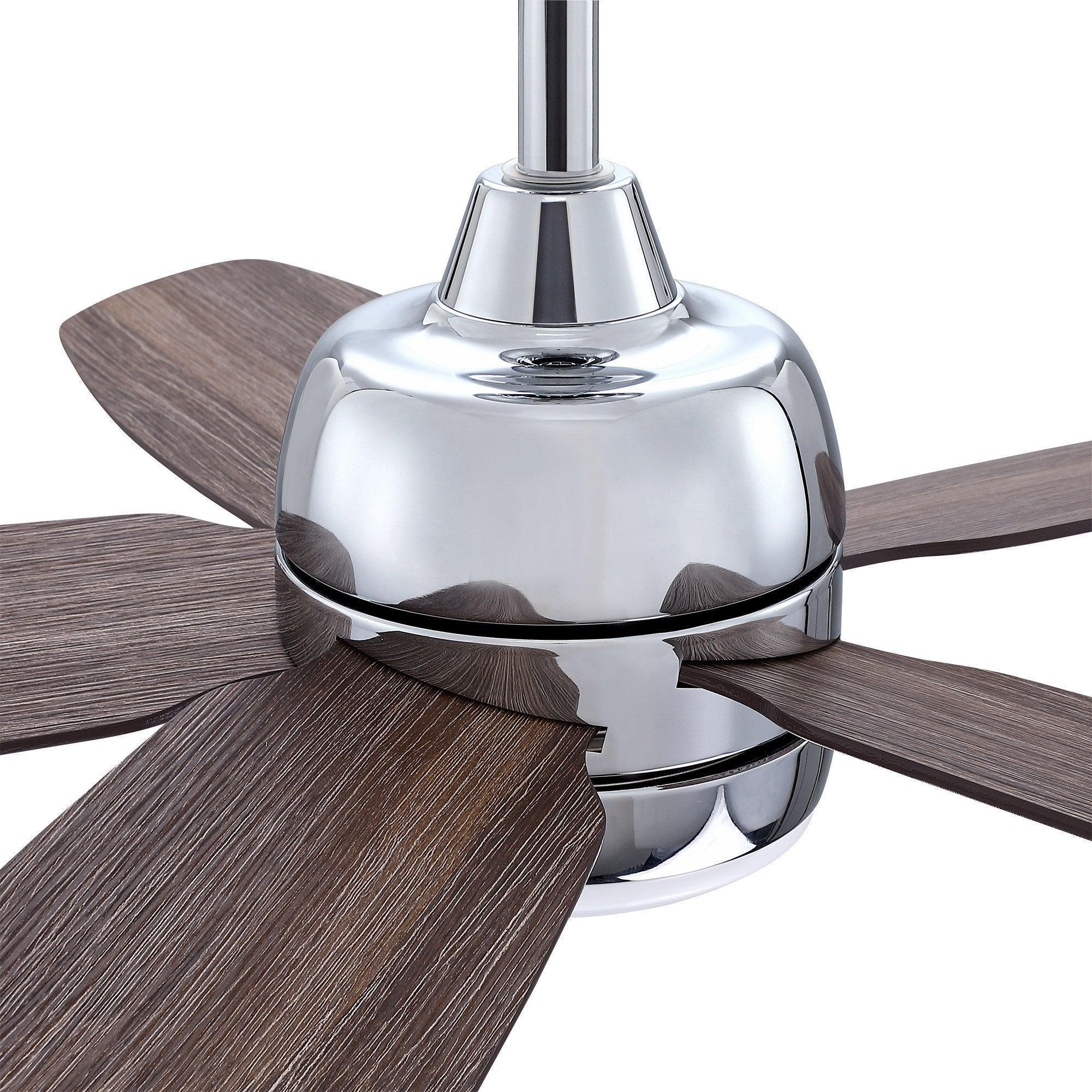 Chrome ceiling fan light dome with five dark wood blades in close-up