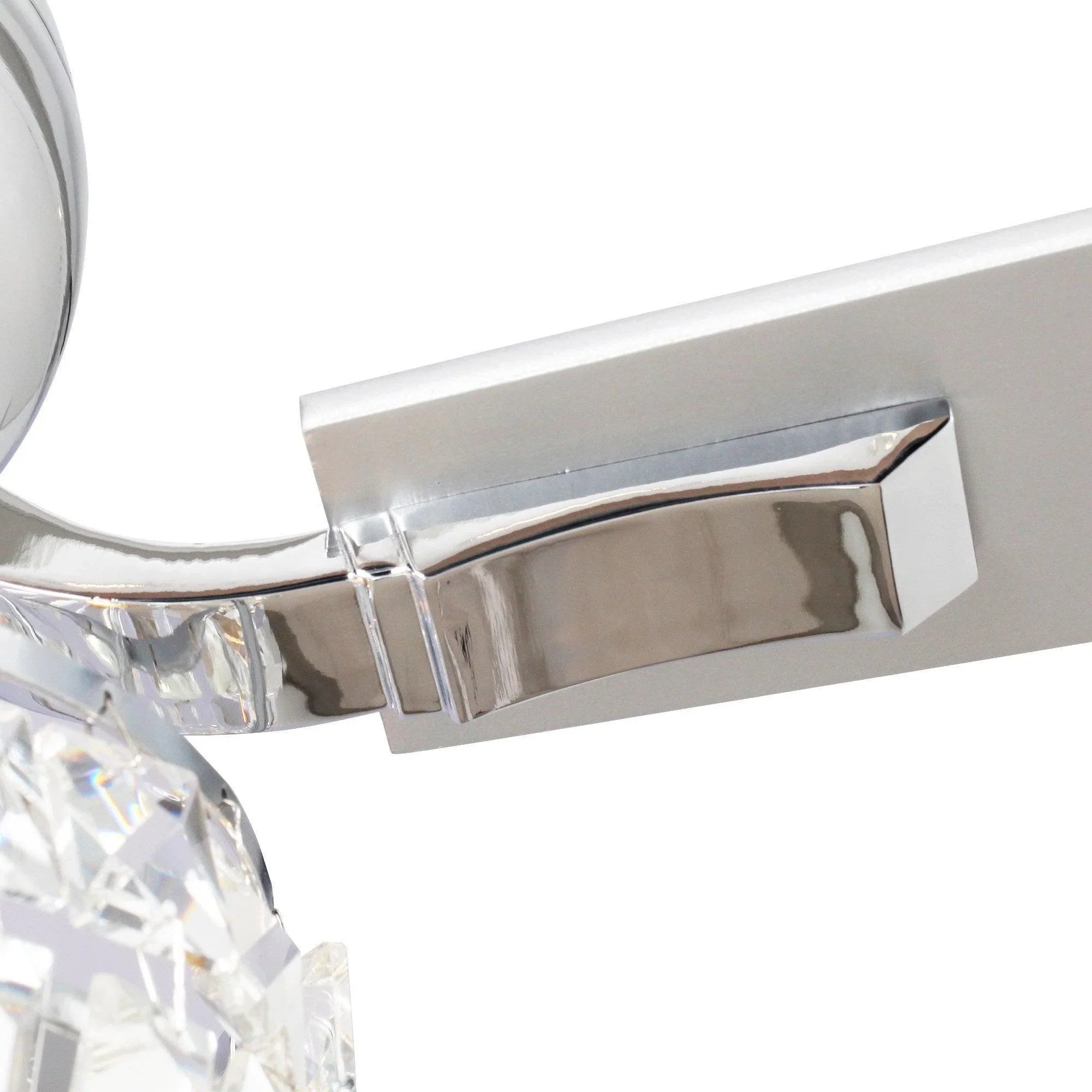 Chrome ceiling fan blade bracket and crystal light housing close-up