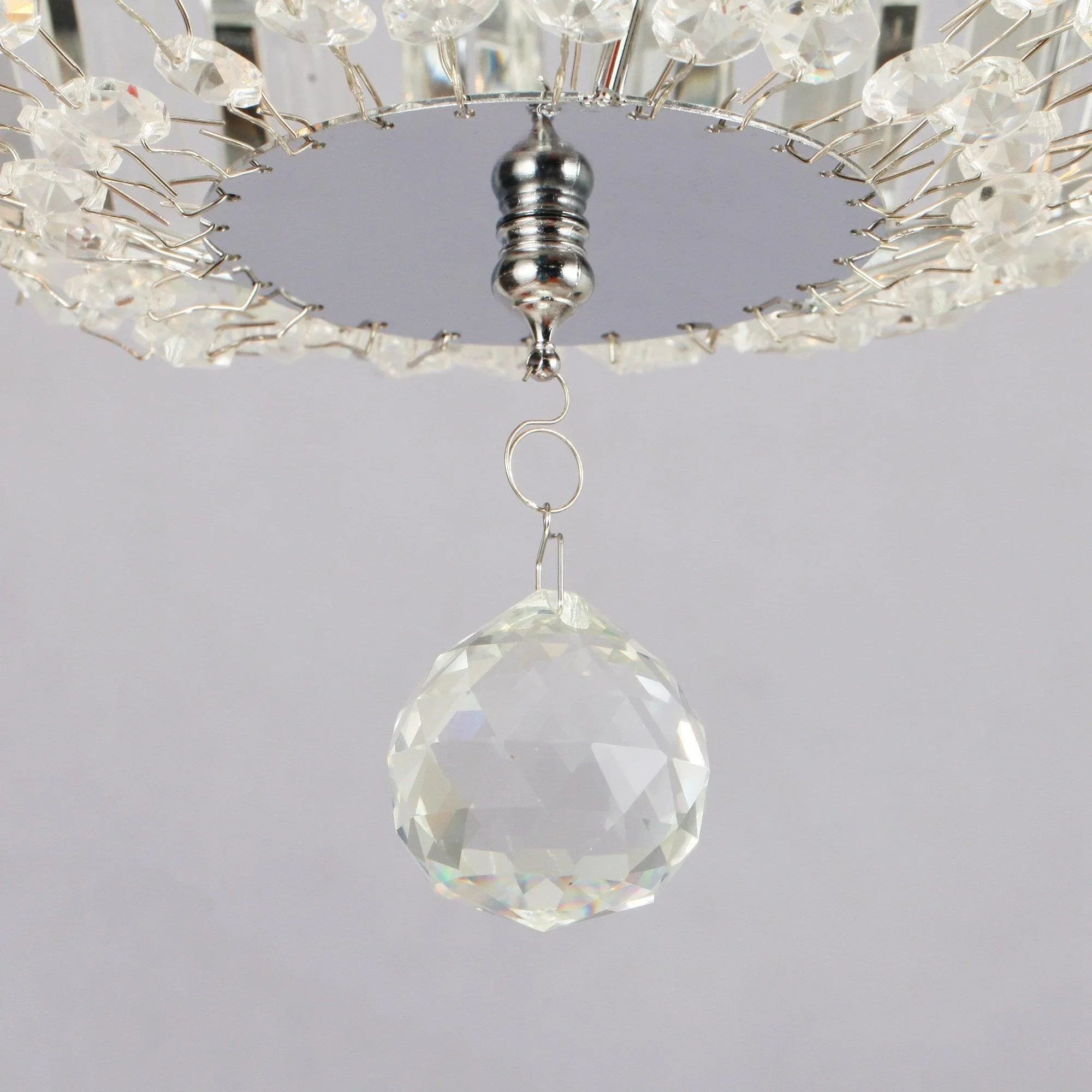 Crystal pendant ornament hanging from a ceiling fan light fixture