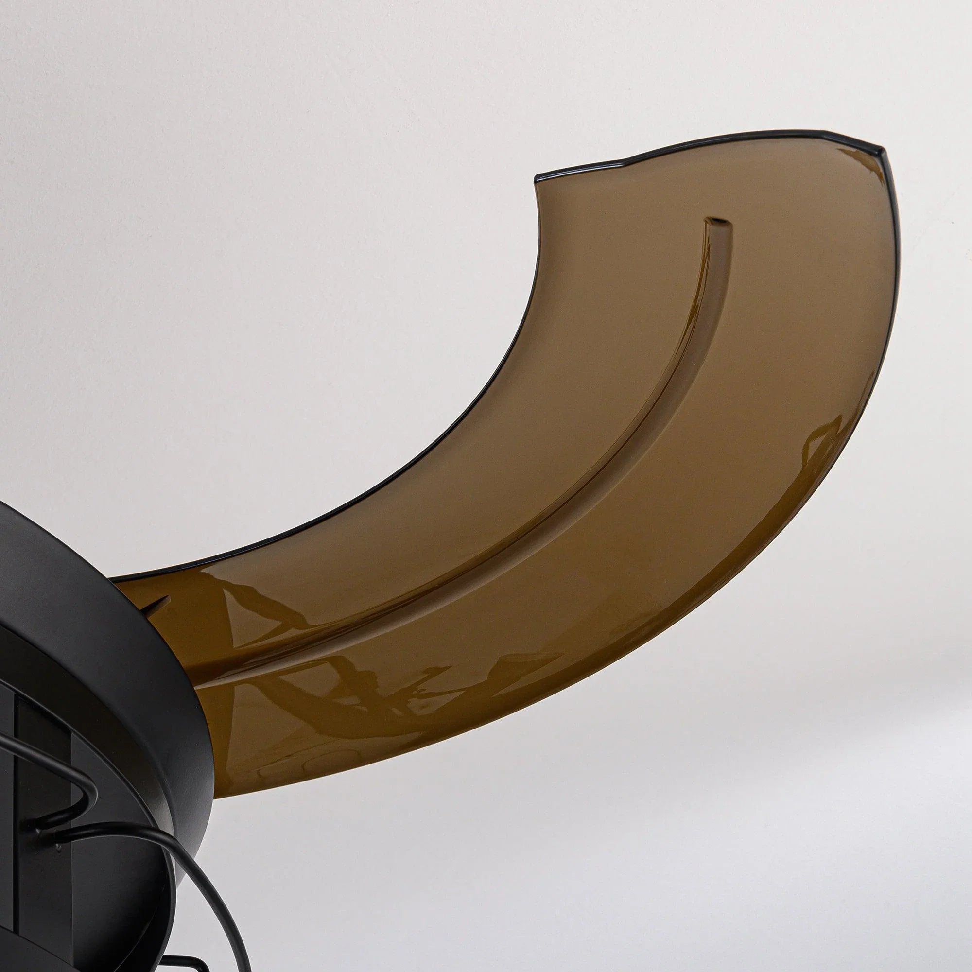 Brown-gold ceiling fan blade edge with glossy finish and black mounting bracket