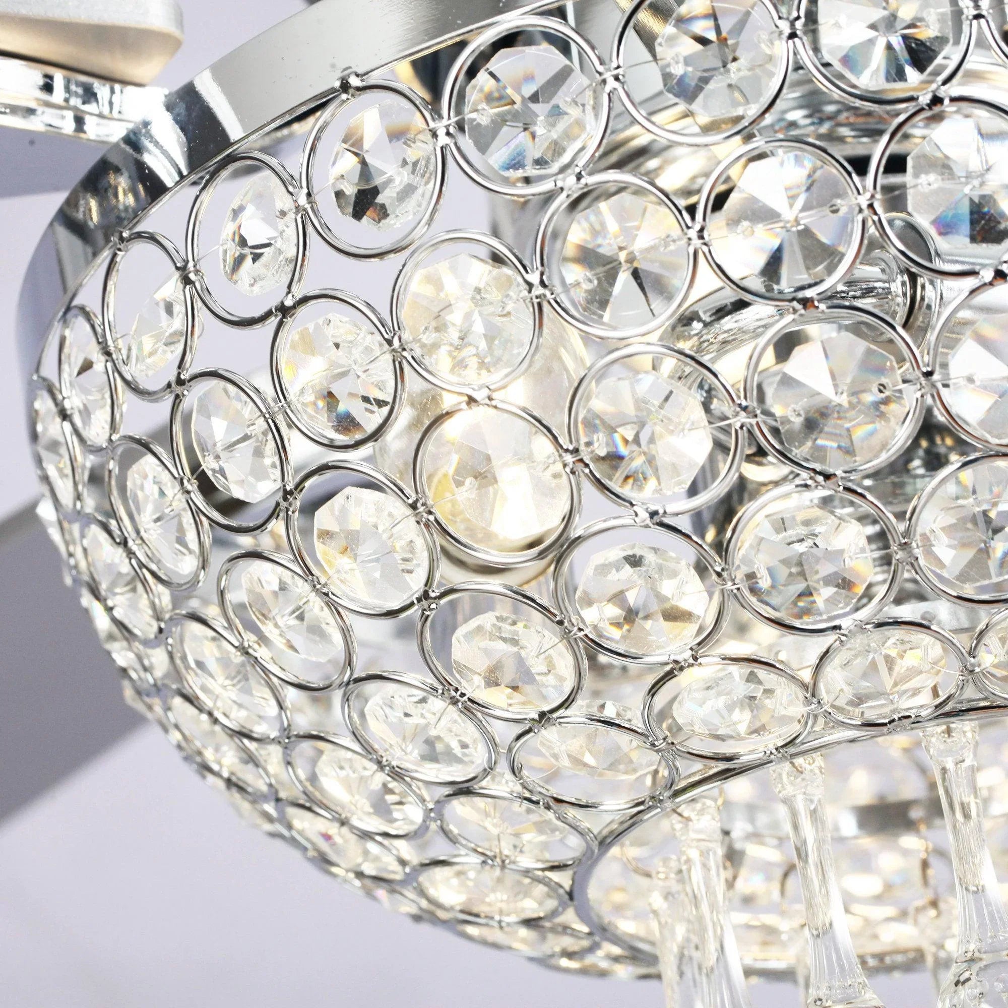 Close-up of crystal chandelier-style shade with chrome frame on ceiling fan