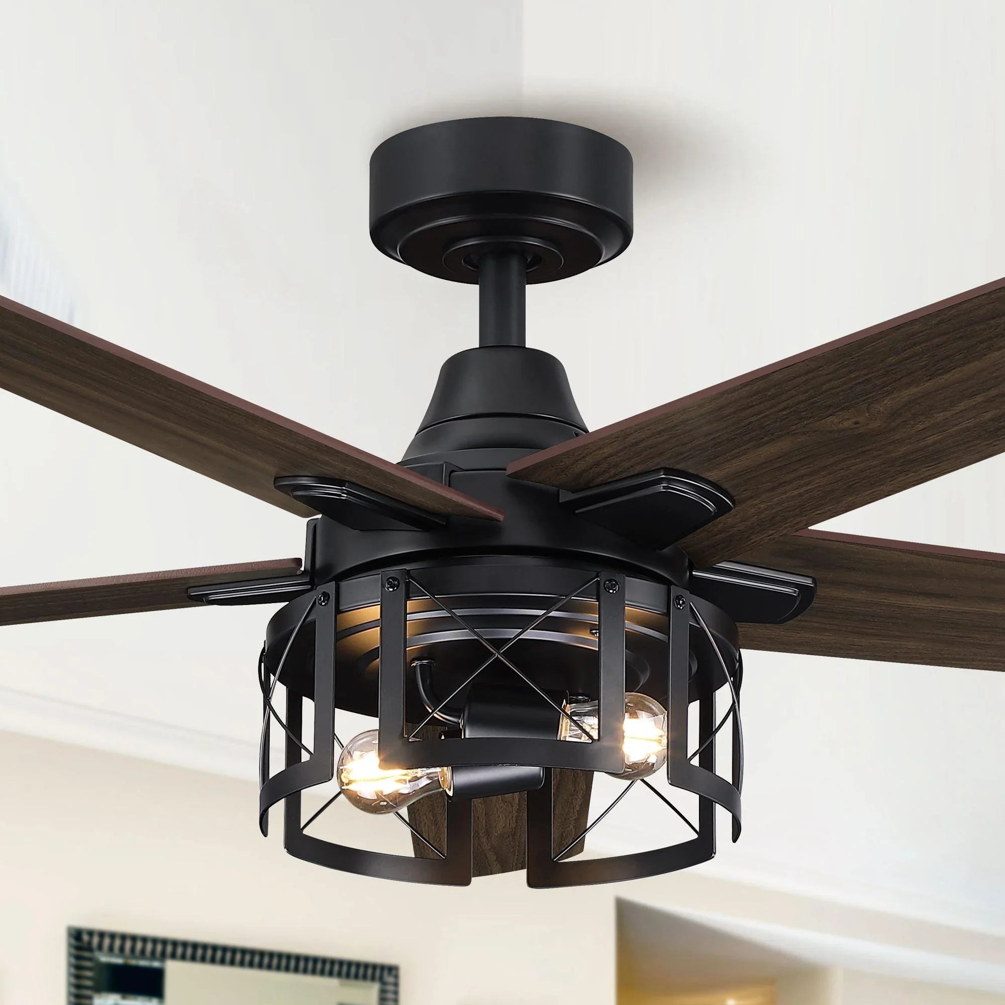 Black ceiling fan with dark wood blades and lantern light with glowing bulbs