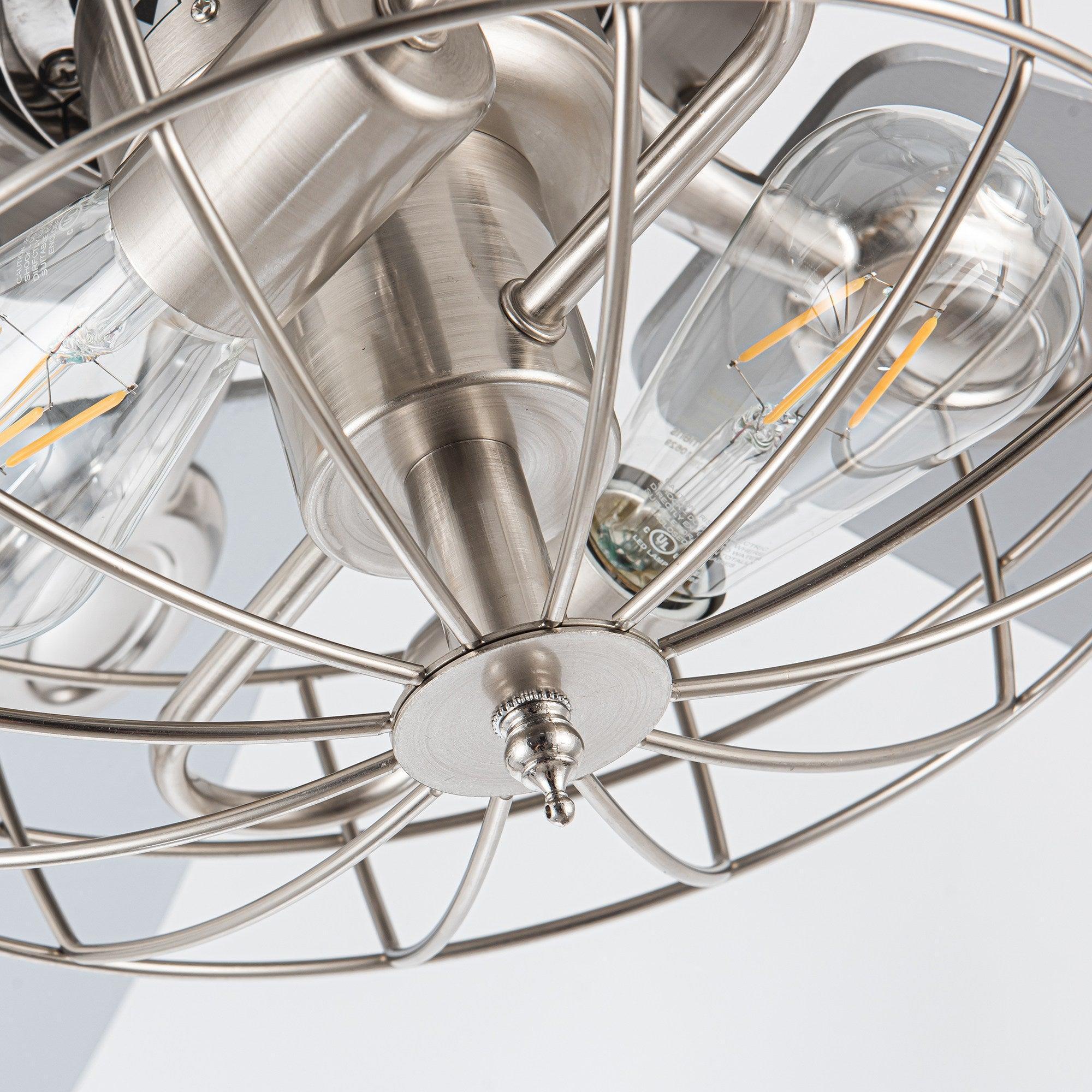 Close-up of brushed nickel caged fan lights with clear glass shades and metal cage
