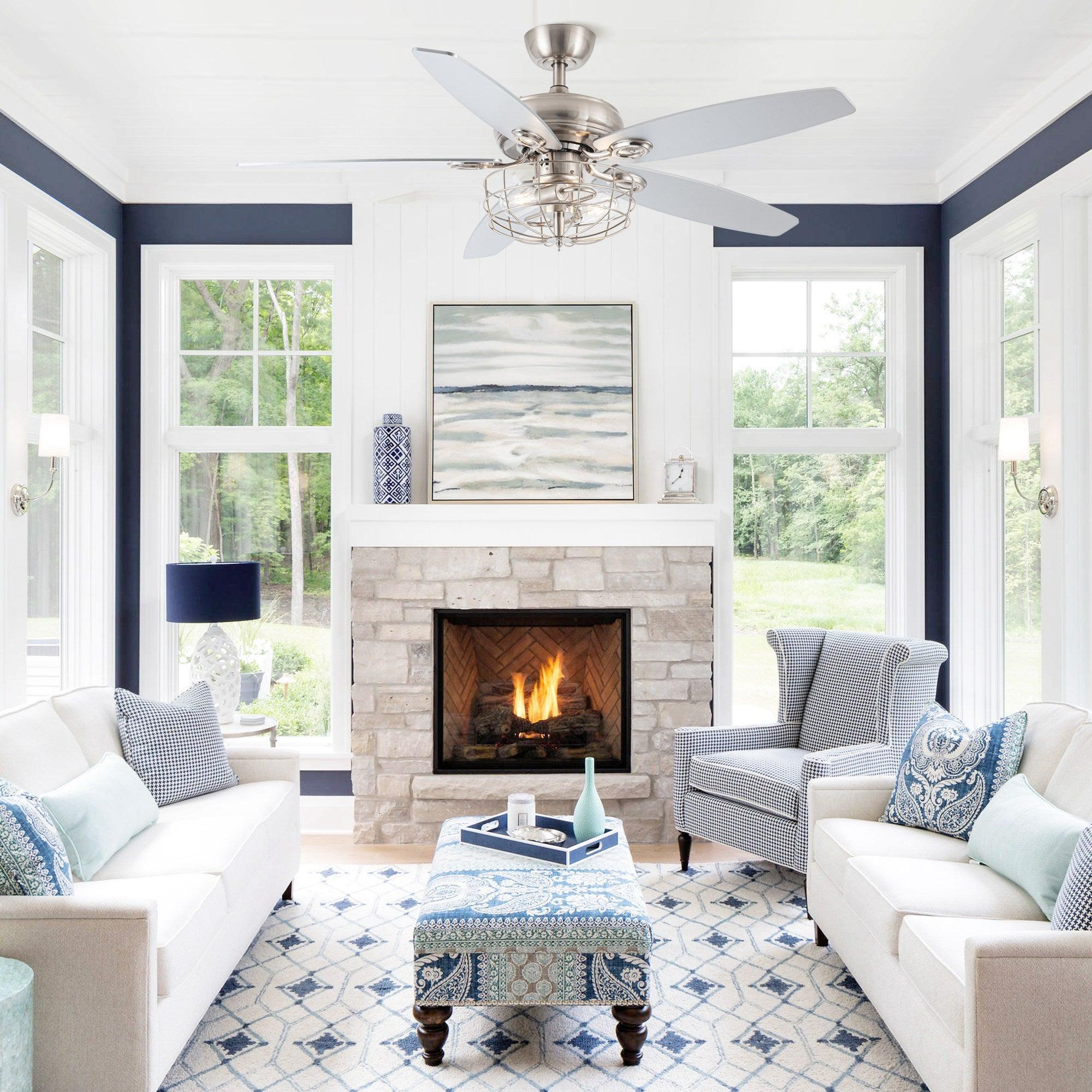 Brushed nickel caged ceiling fan with reversible blades installed in a living room