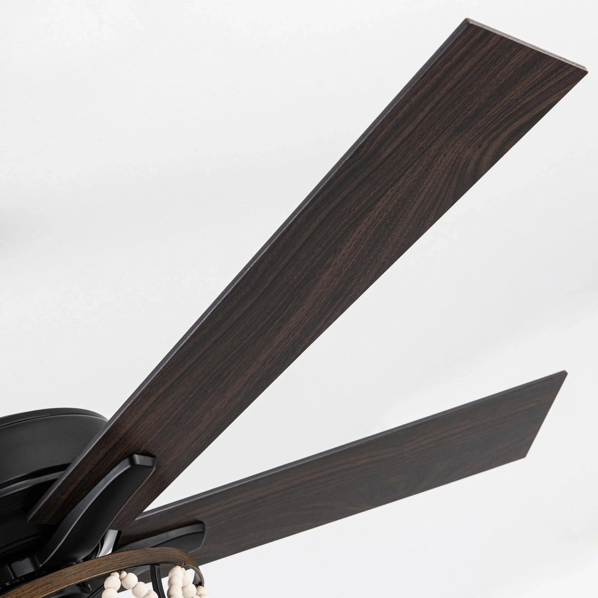 Industrial ceiling fan with dark wood reversible blades and black motor housing