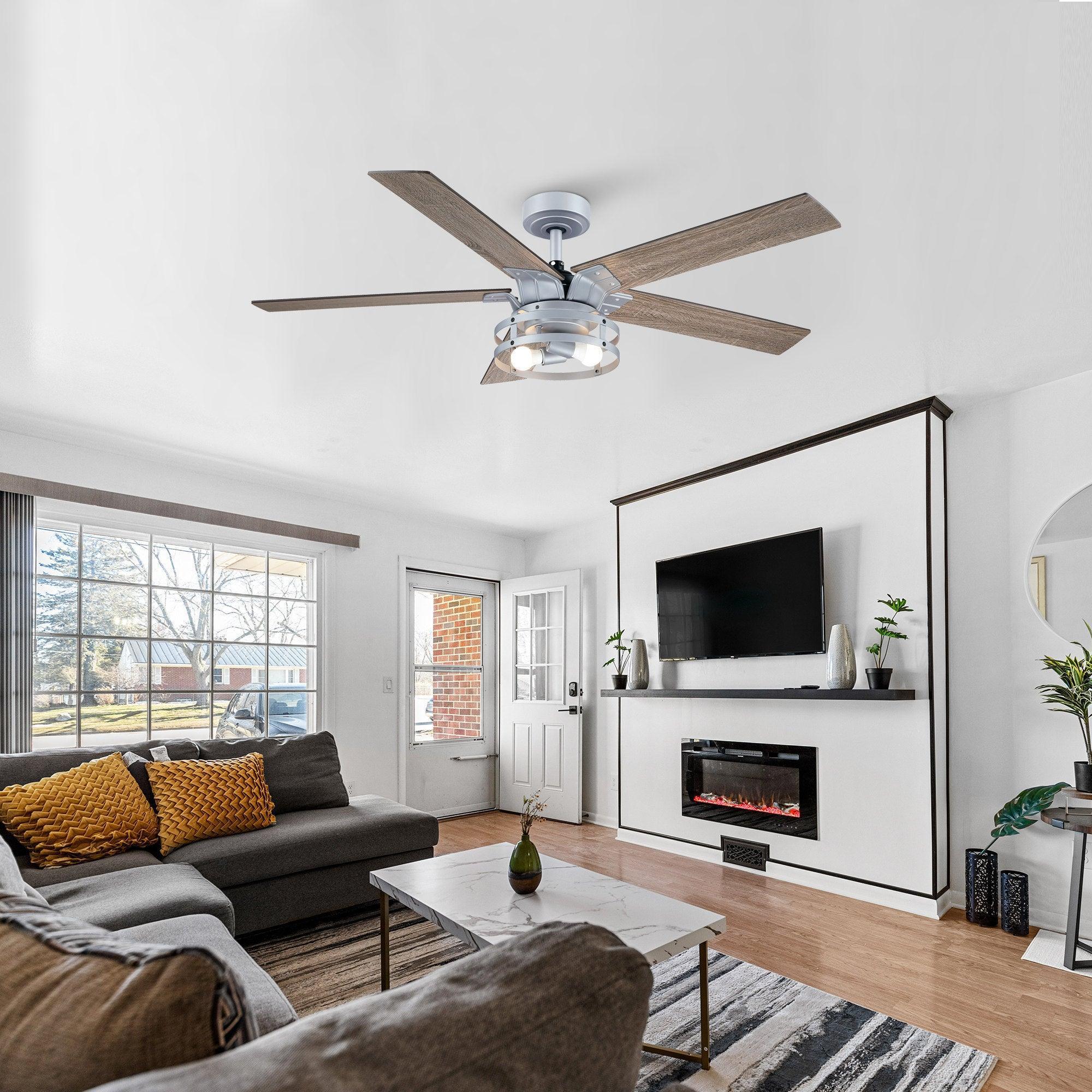 Industrial ceiling fan with light kit and four wood blades, downrod mount, silver finish.