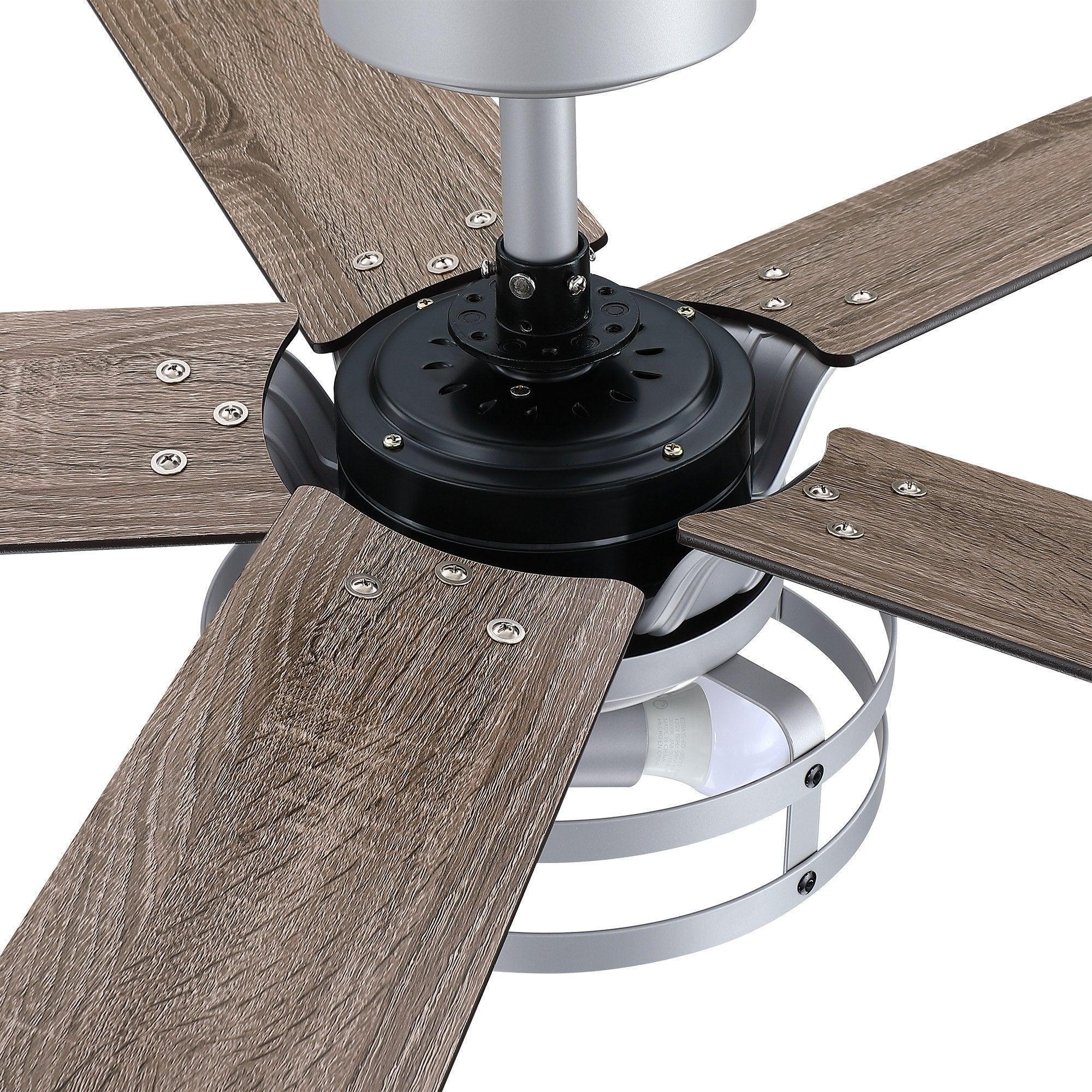 Ceiling fan base with integrated light, black hub and dark wood blades