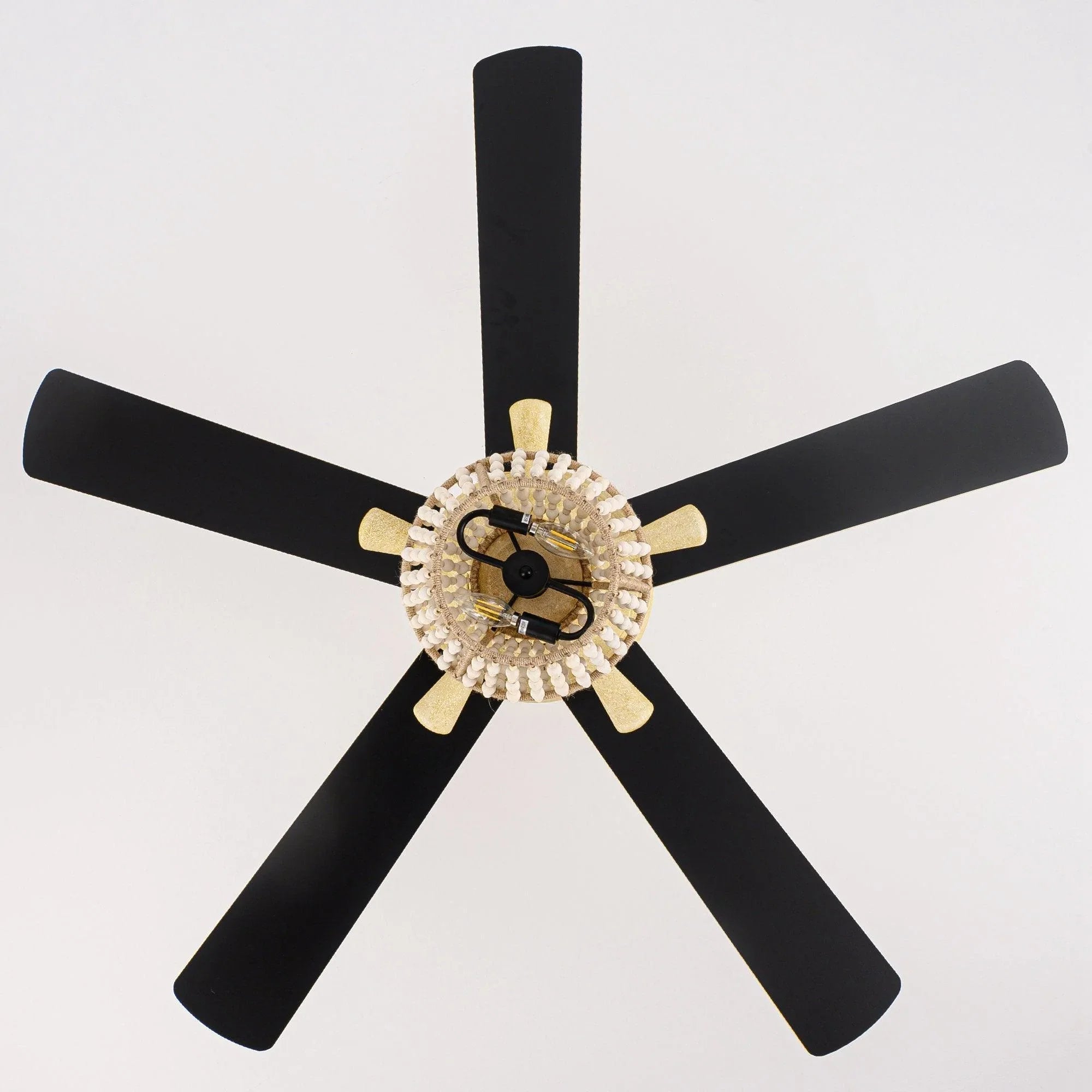 Black-and-gold reversible ceiling fan with 5 blades and decorative globe light