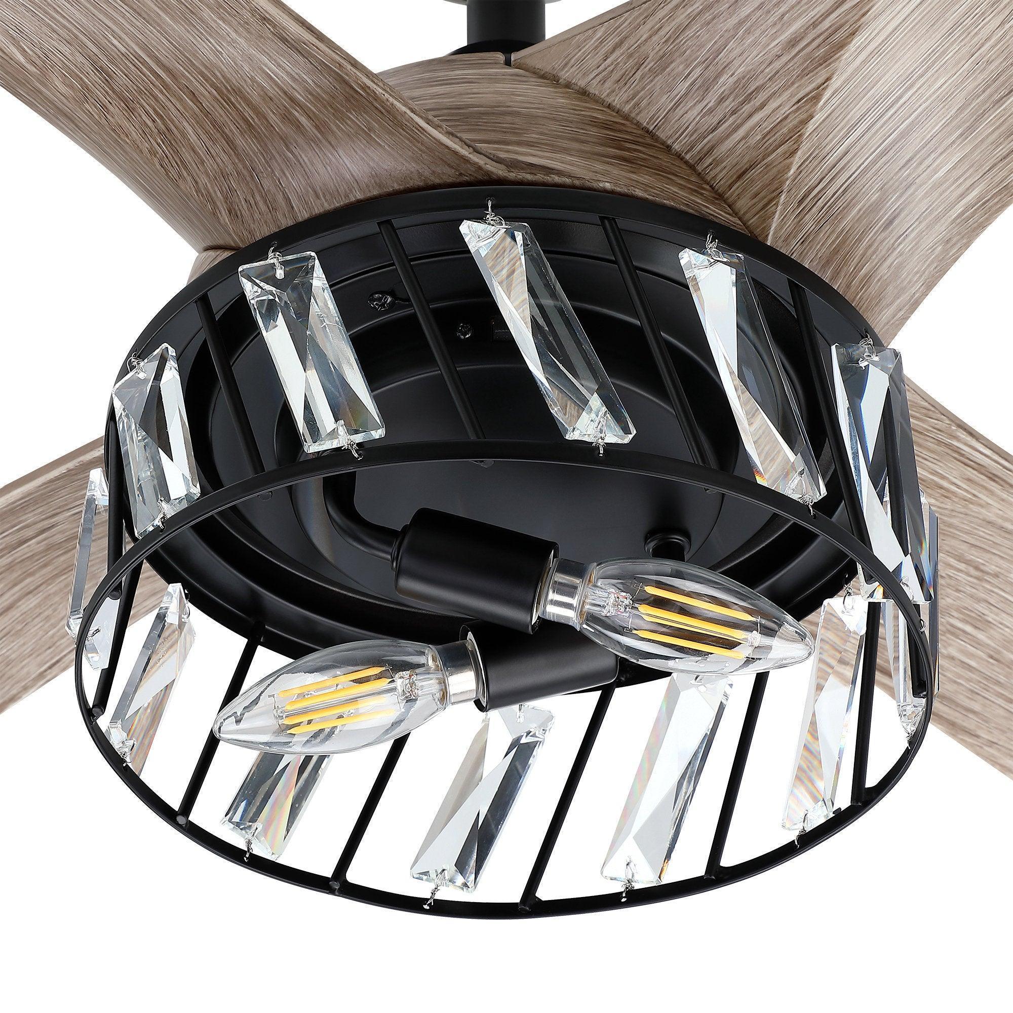 Close-up of black fan light housing with clear crystal glass panels and wood blades
