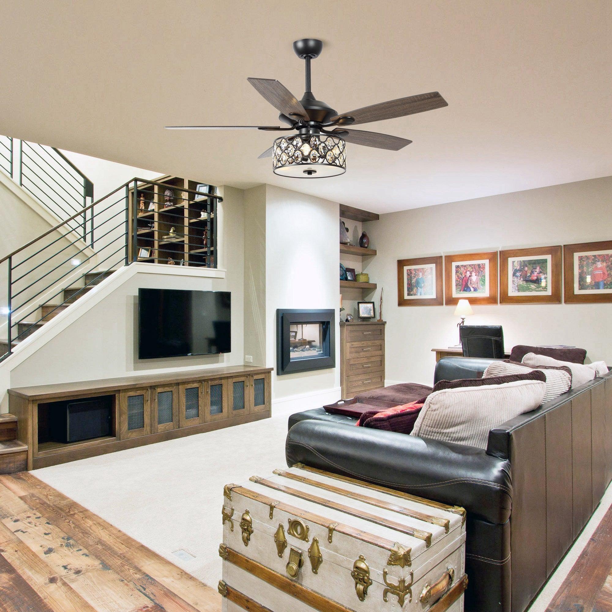 Ceiling fan with dark wood blades and sparkling crystal glass light installed