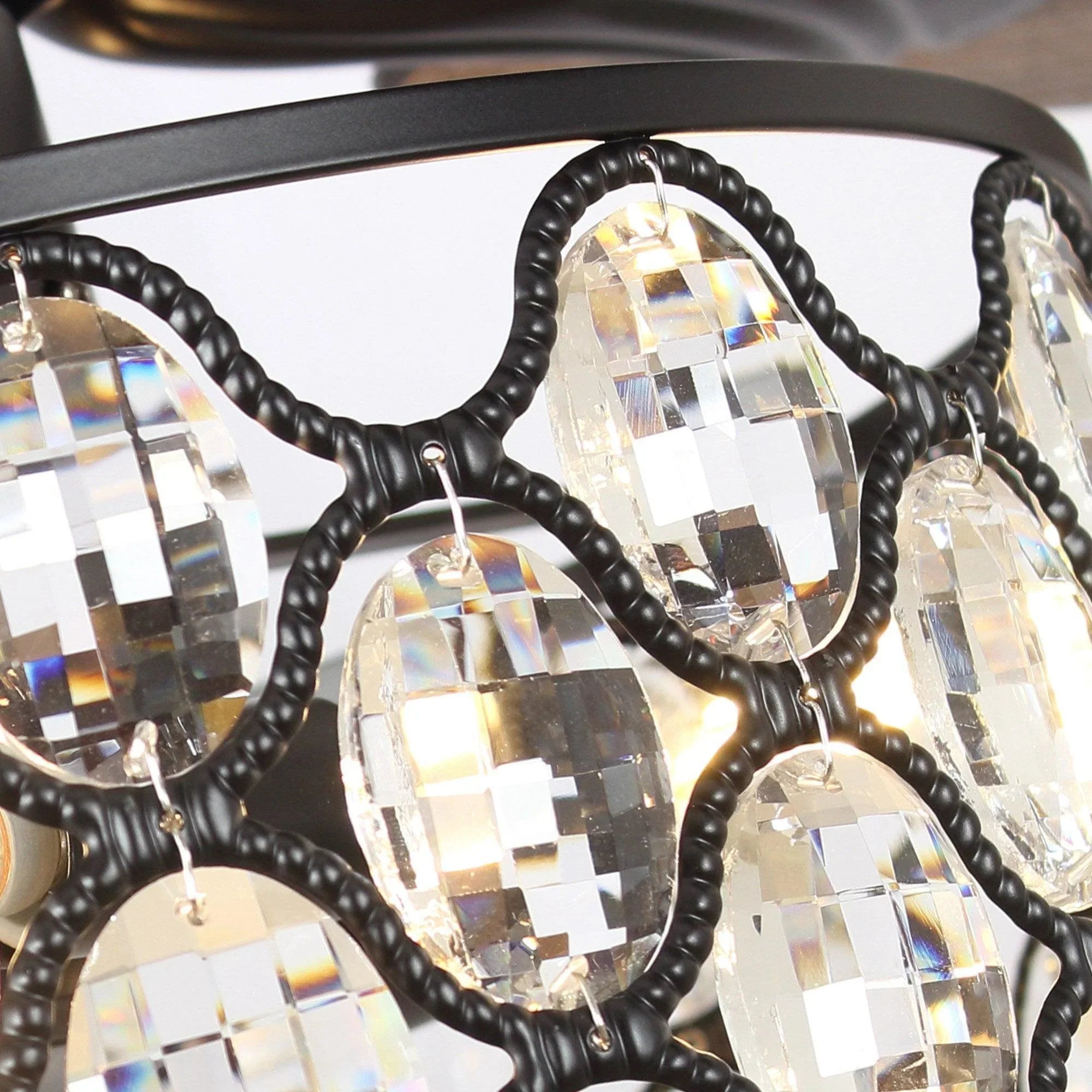 Close-up of crystal glass lamp elements with black twisted wiring accents
