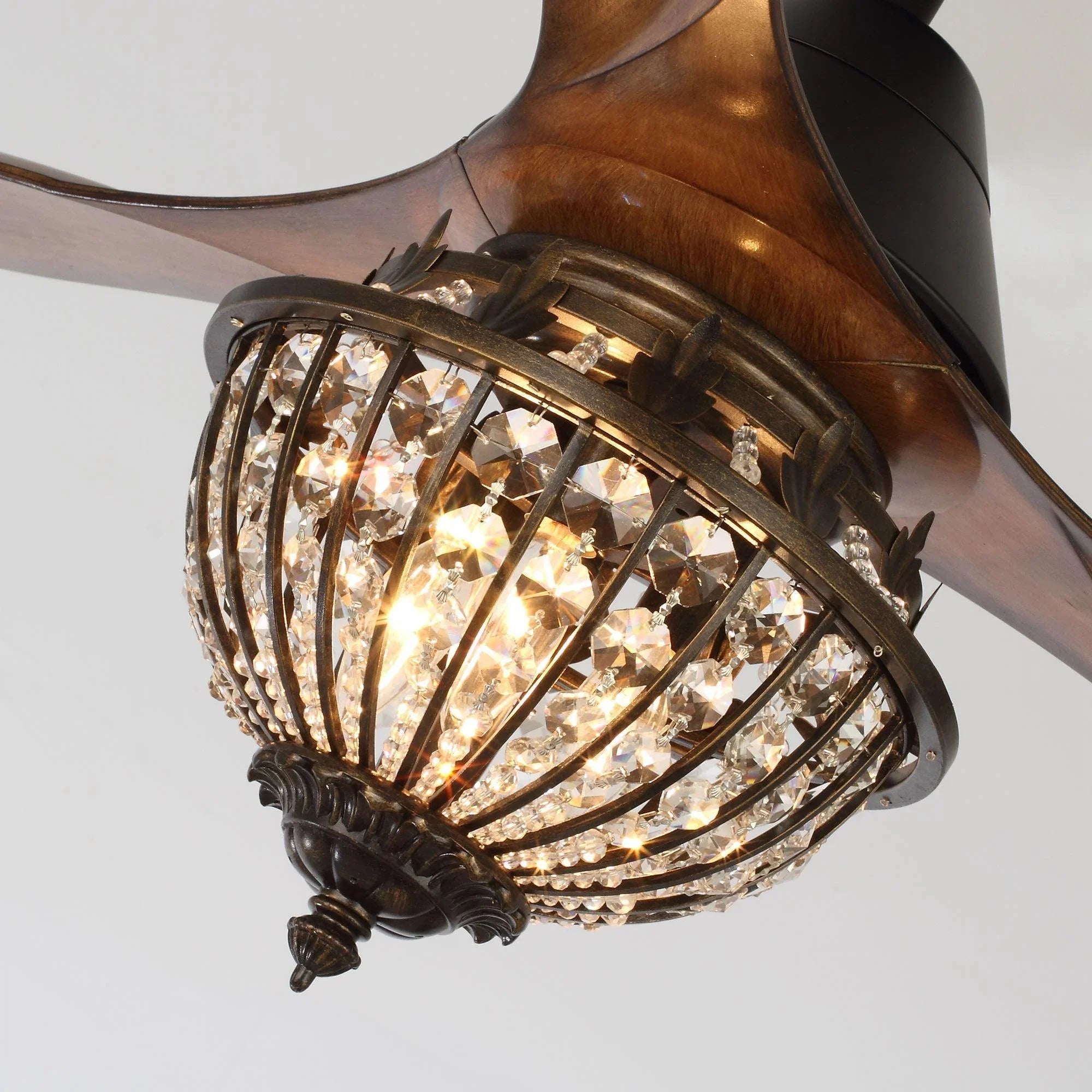 Ceiling fan light kit with crystal glass panels in a black metal cage housing