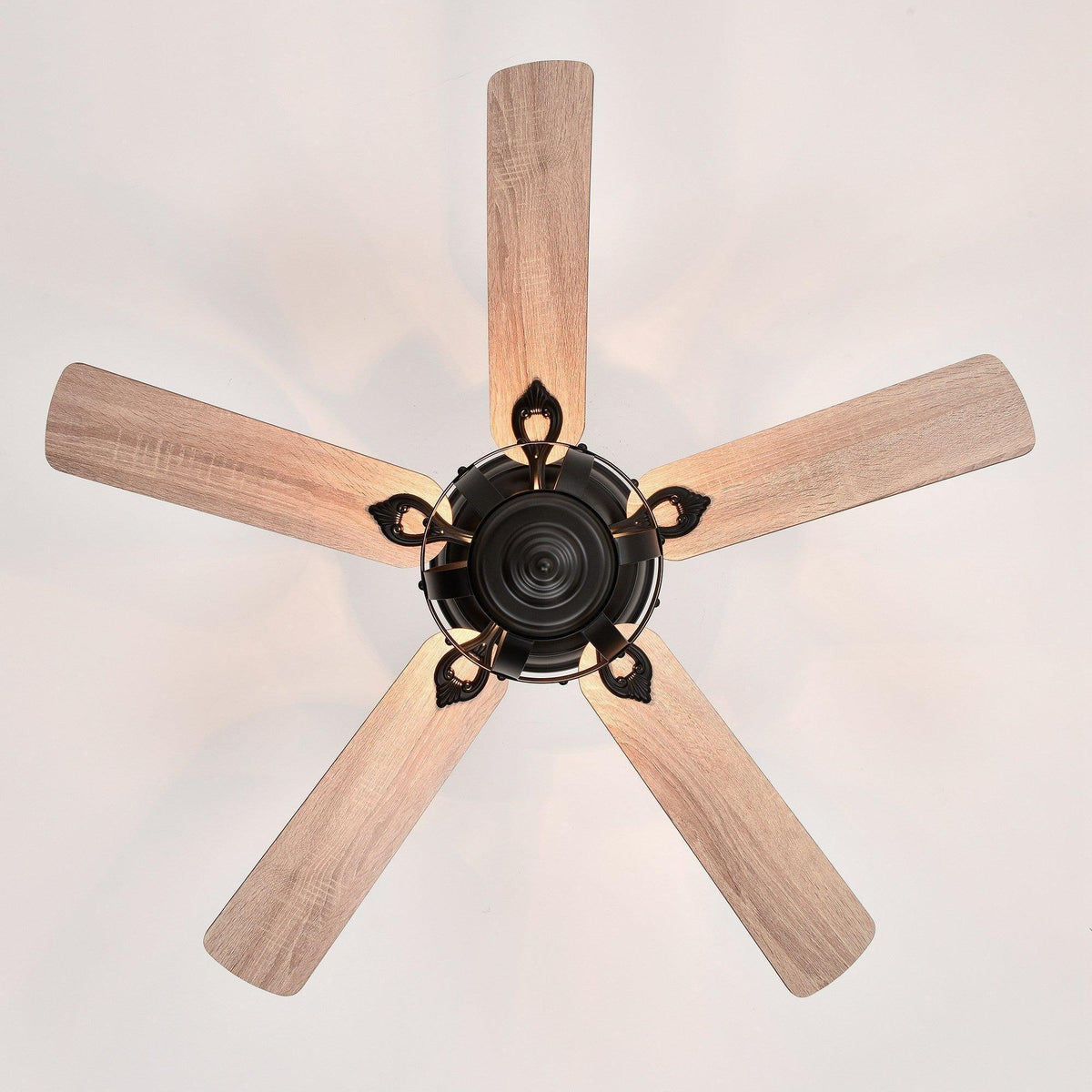 Black ceiling fan with lantern light and four wood-toned reversible blades
