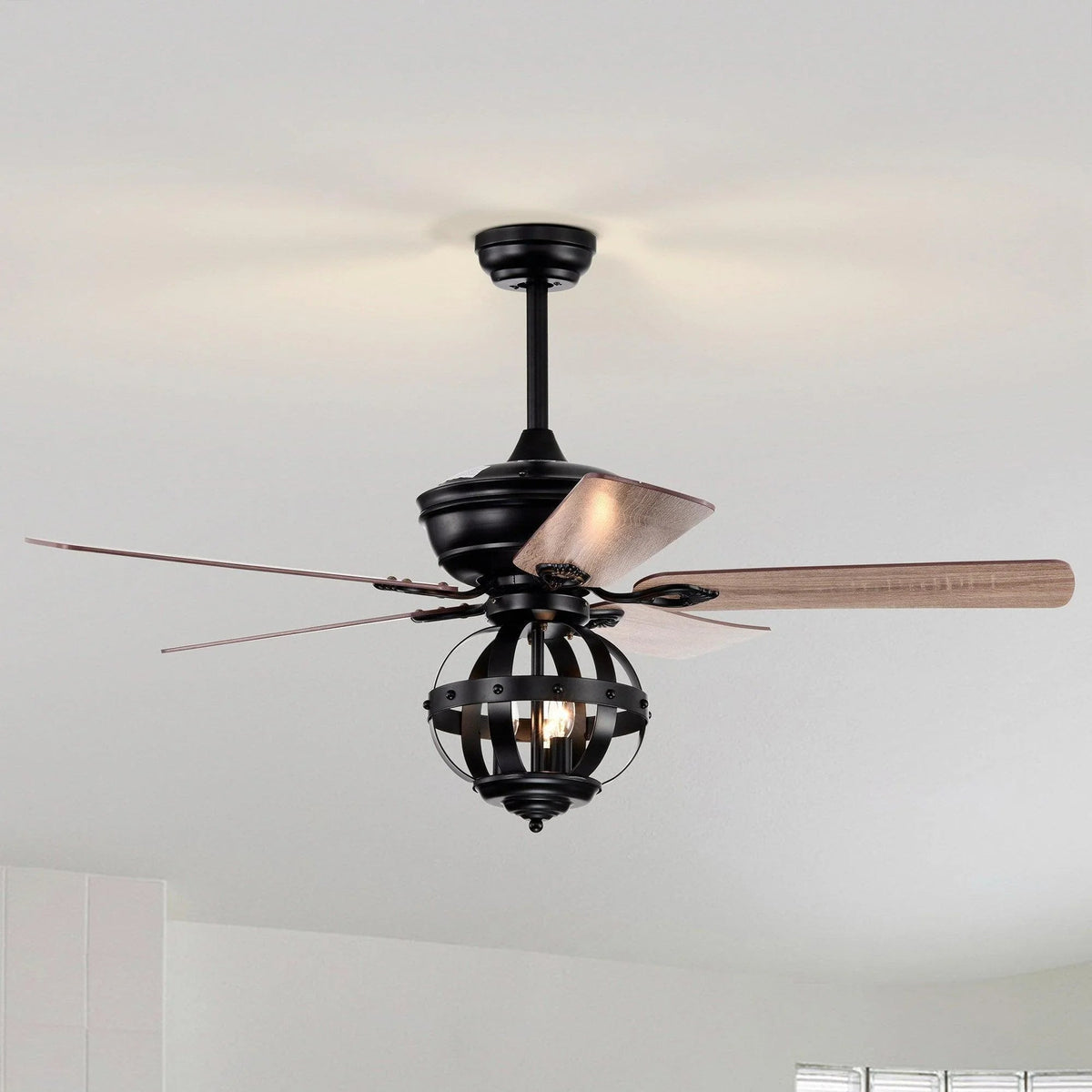 Black industrial ceiling fan with light kit and wood-toned reversible blades