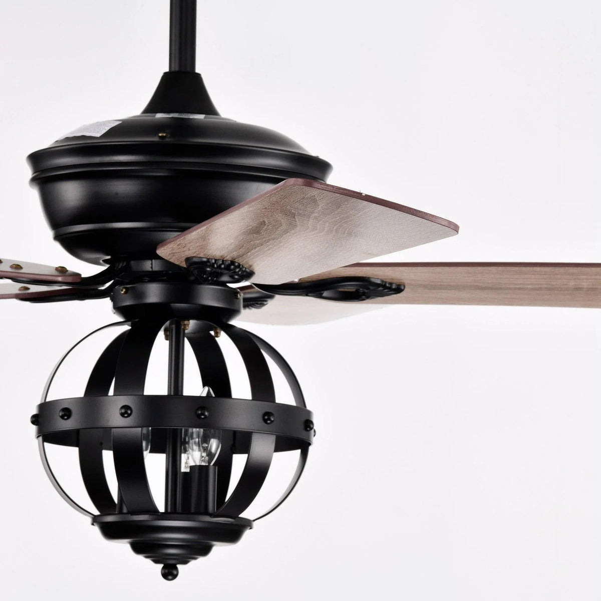 Black ceiling fan motor housing with wood-toned reversible blade and lantern light