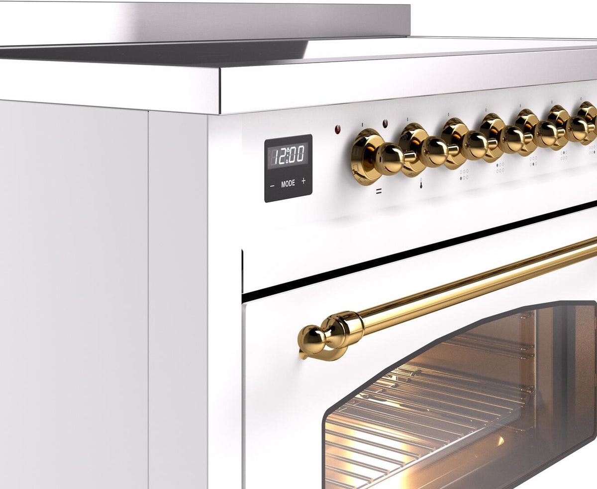 White range control panel with brass knobs and clock display near the oven door