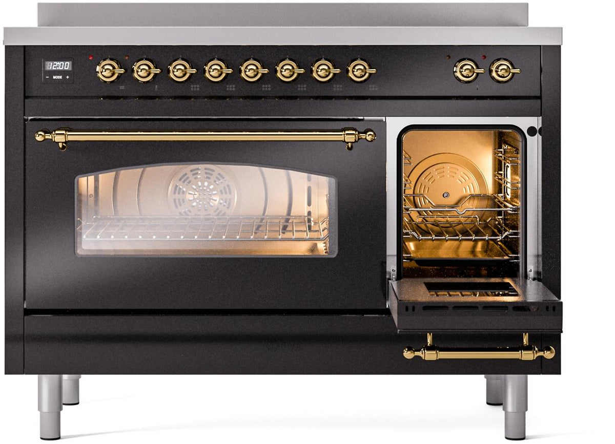 Freestanding electric induction range with right oven door open and internal light