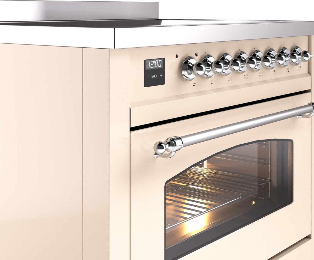 Freestanding electric induction range control panel with chrome knobs and stainless handle