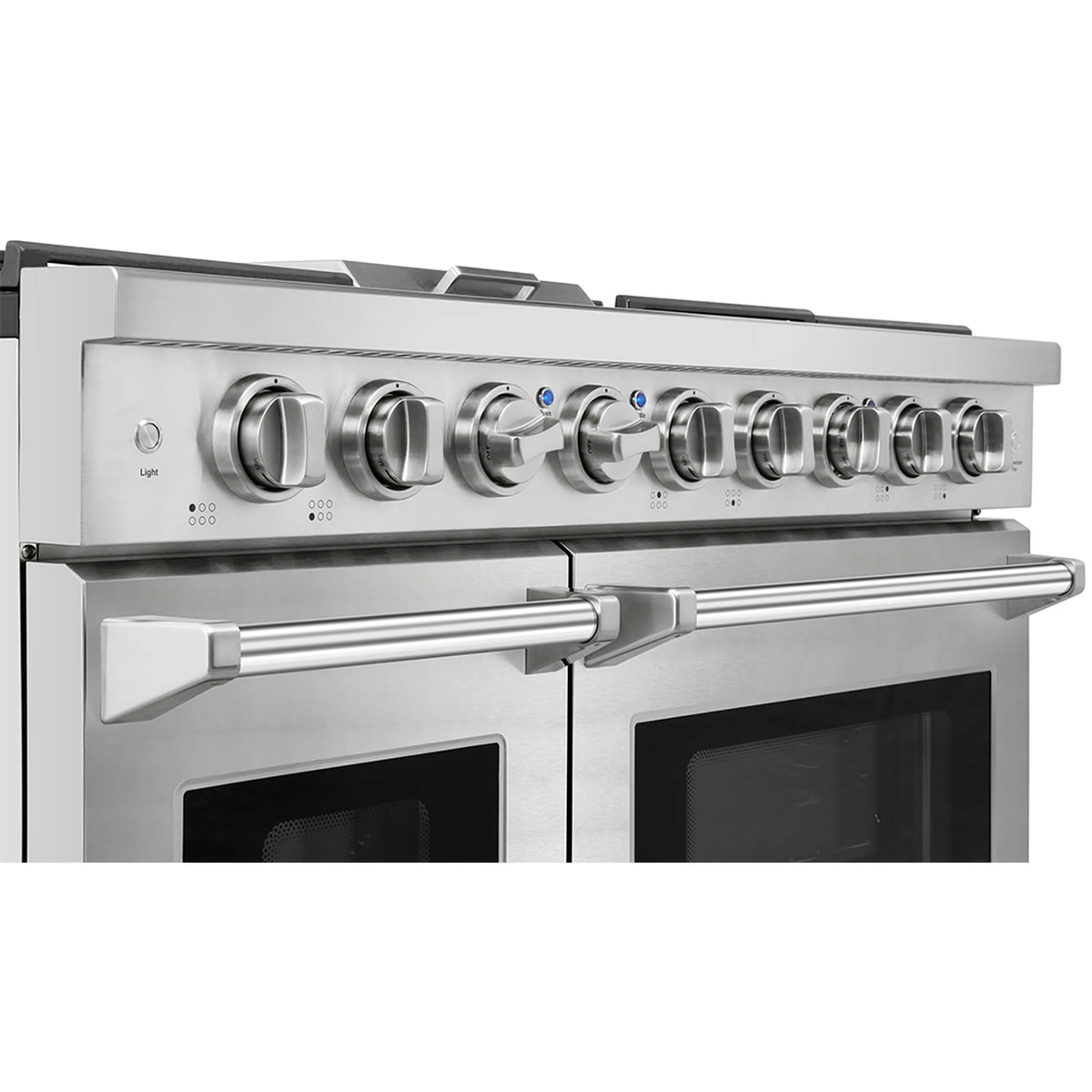 Stainless gas range control panel with metal knobs above burner grates