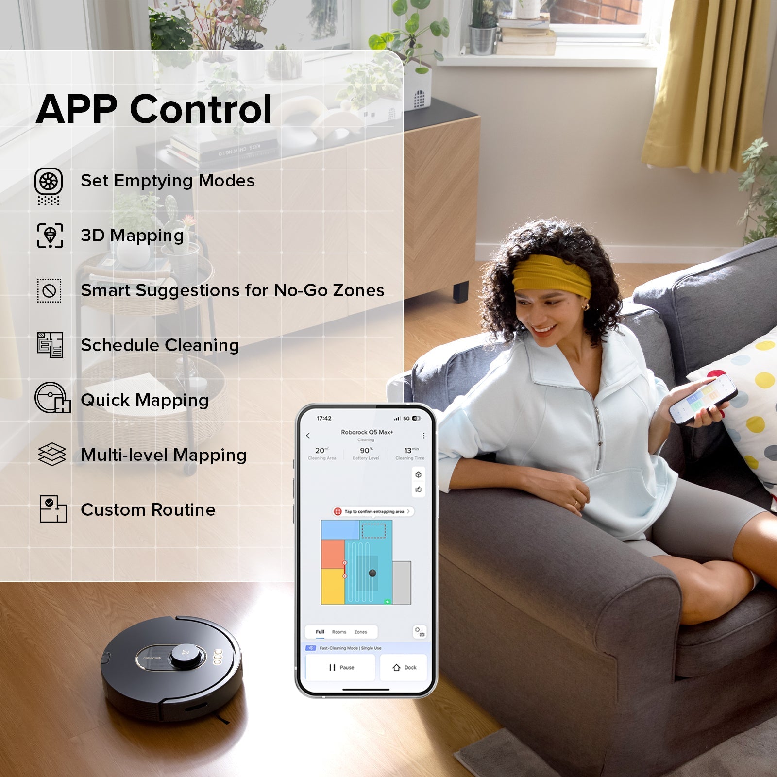 Roborock robot vacuum with smartphone app control, dark gray on living room floor