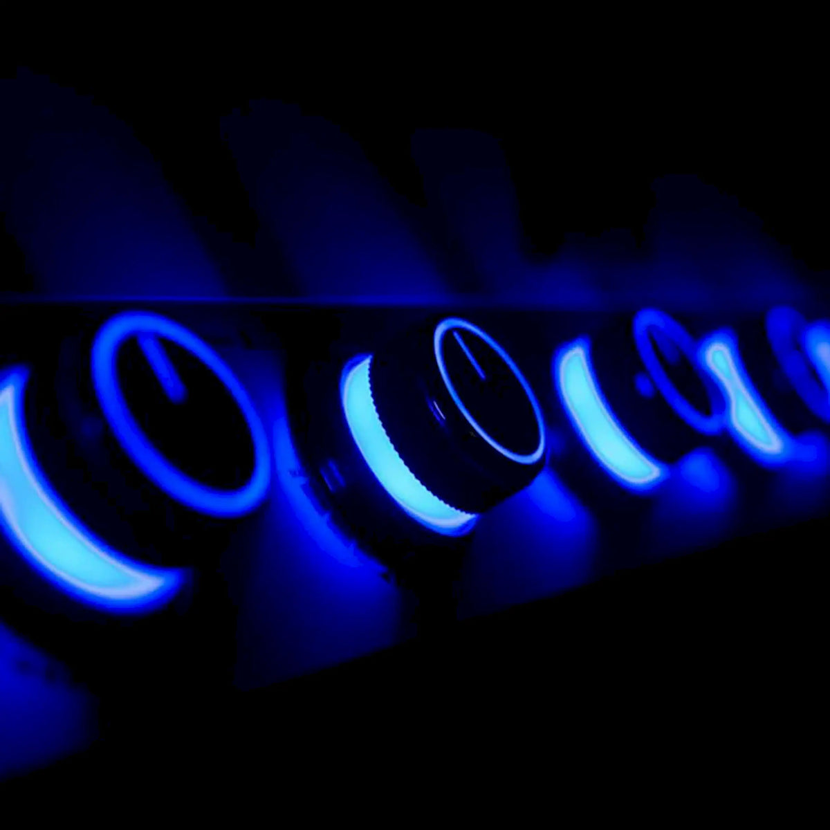 Blue illuminated control label area on stainless grill panel