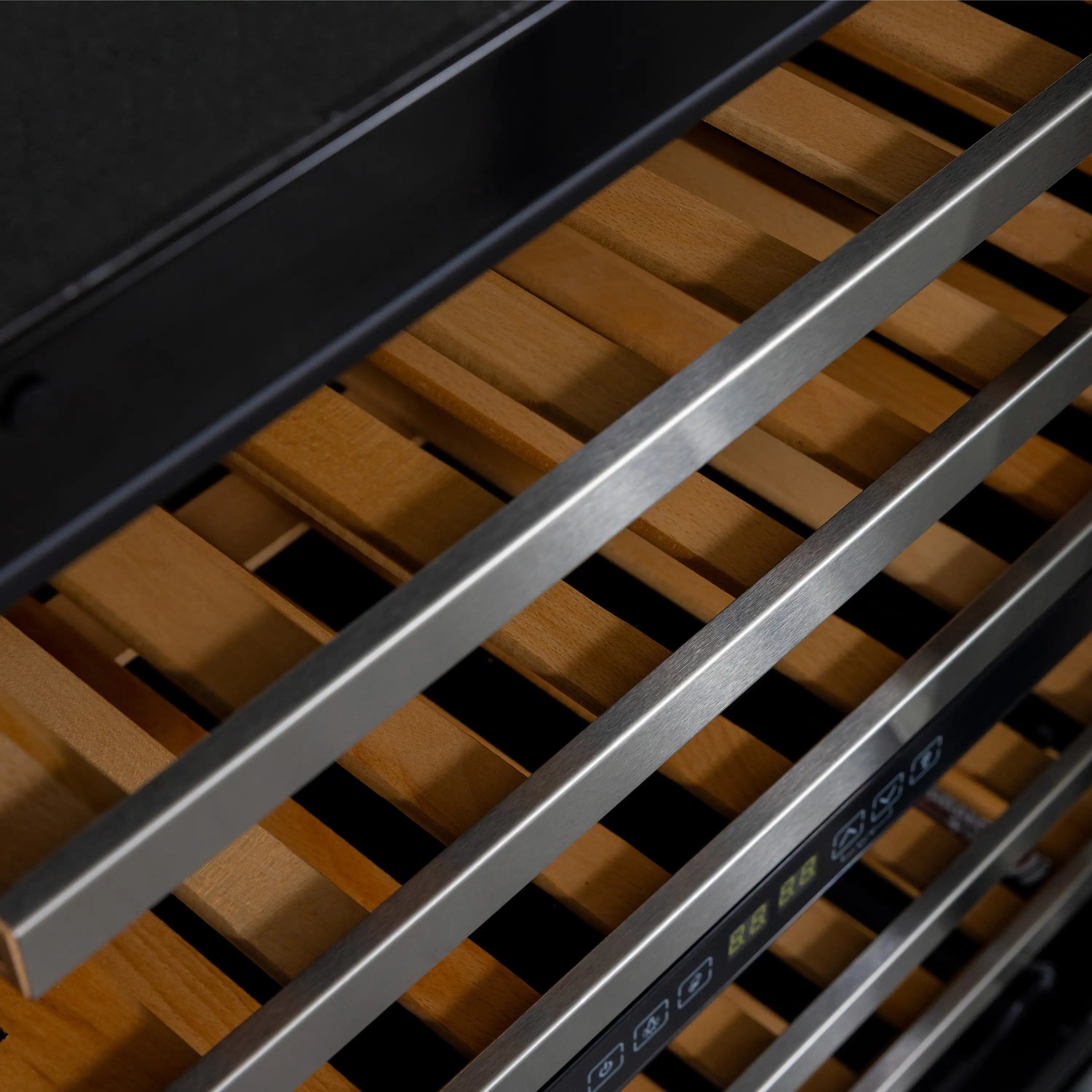 Wine cooler wood rack shelves inside black cabinet with front control panel strip