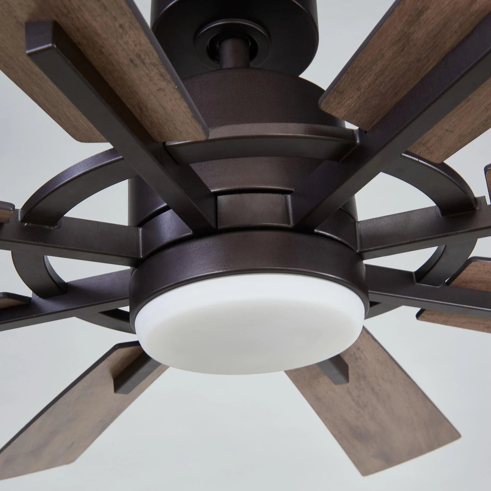 Oil-rubbed bronze windmill ceiling fan with LED light and five wood blades, close-up