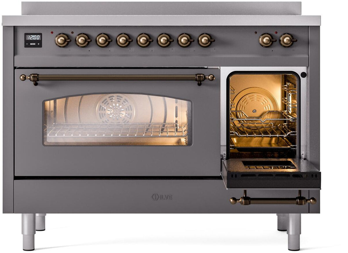 Matte graphite oven door open to show lit racks with bronze control trim