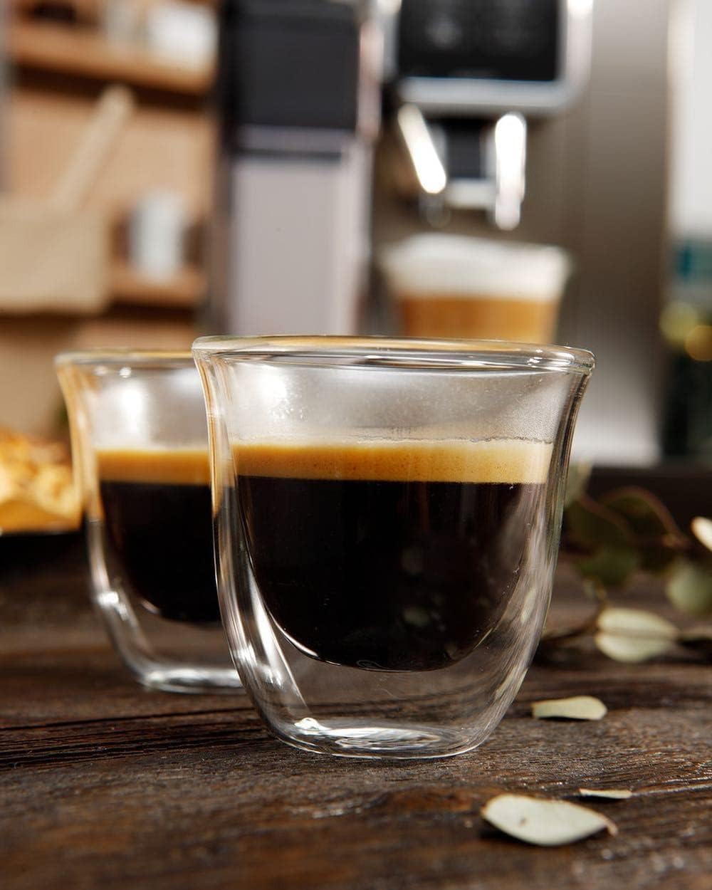Set of clear espresso glasses filled with dark espresso and crema